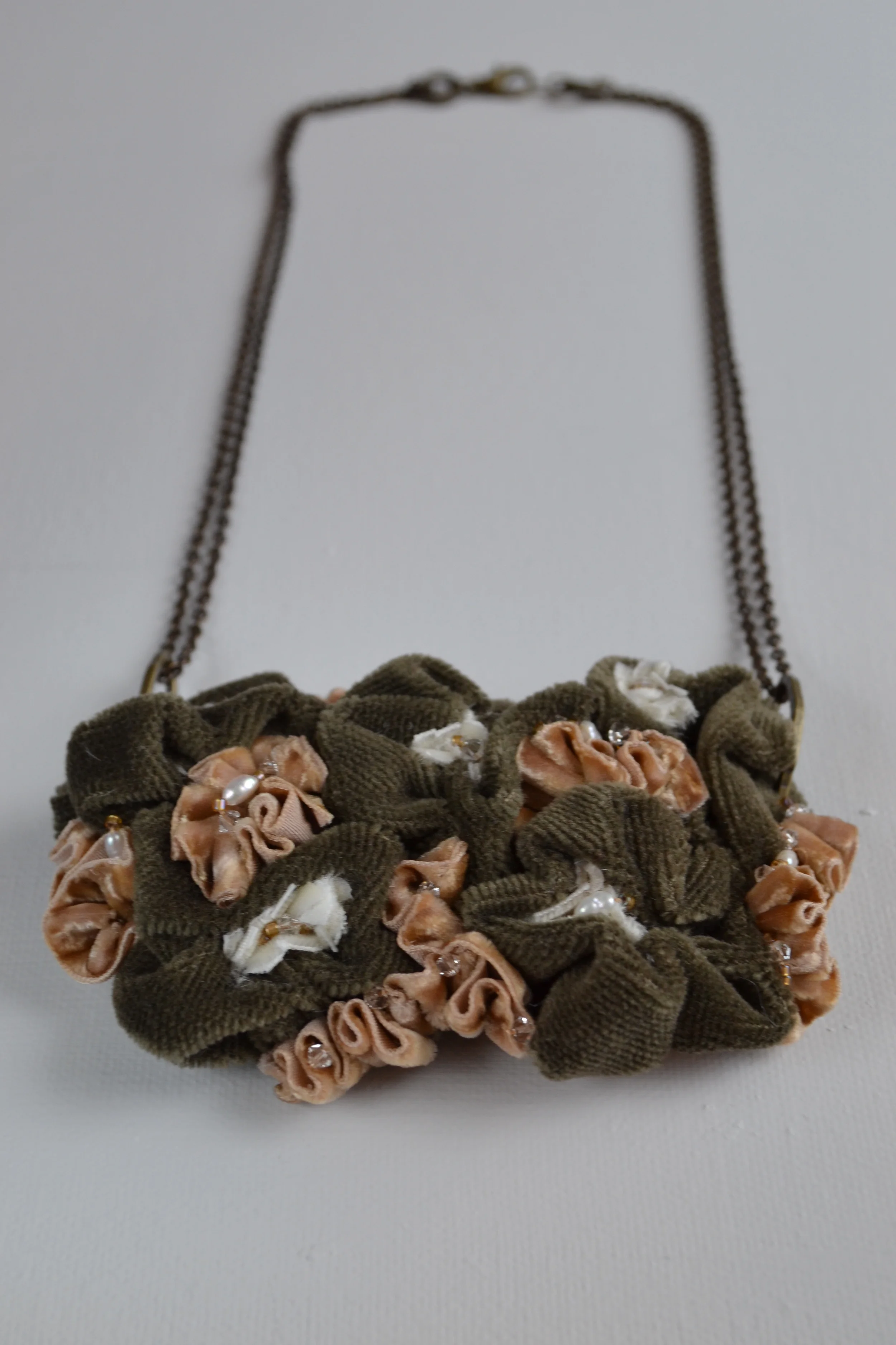 Bouquet style necklace from L.E.W. designs. Green velvet, featuring pearls and crystals. Hand sewn. Click through for more information..JPG