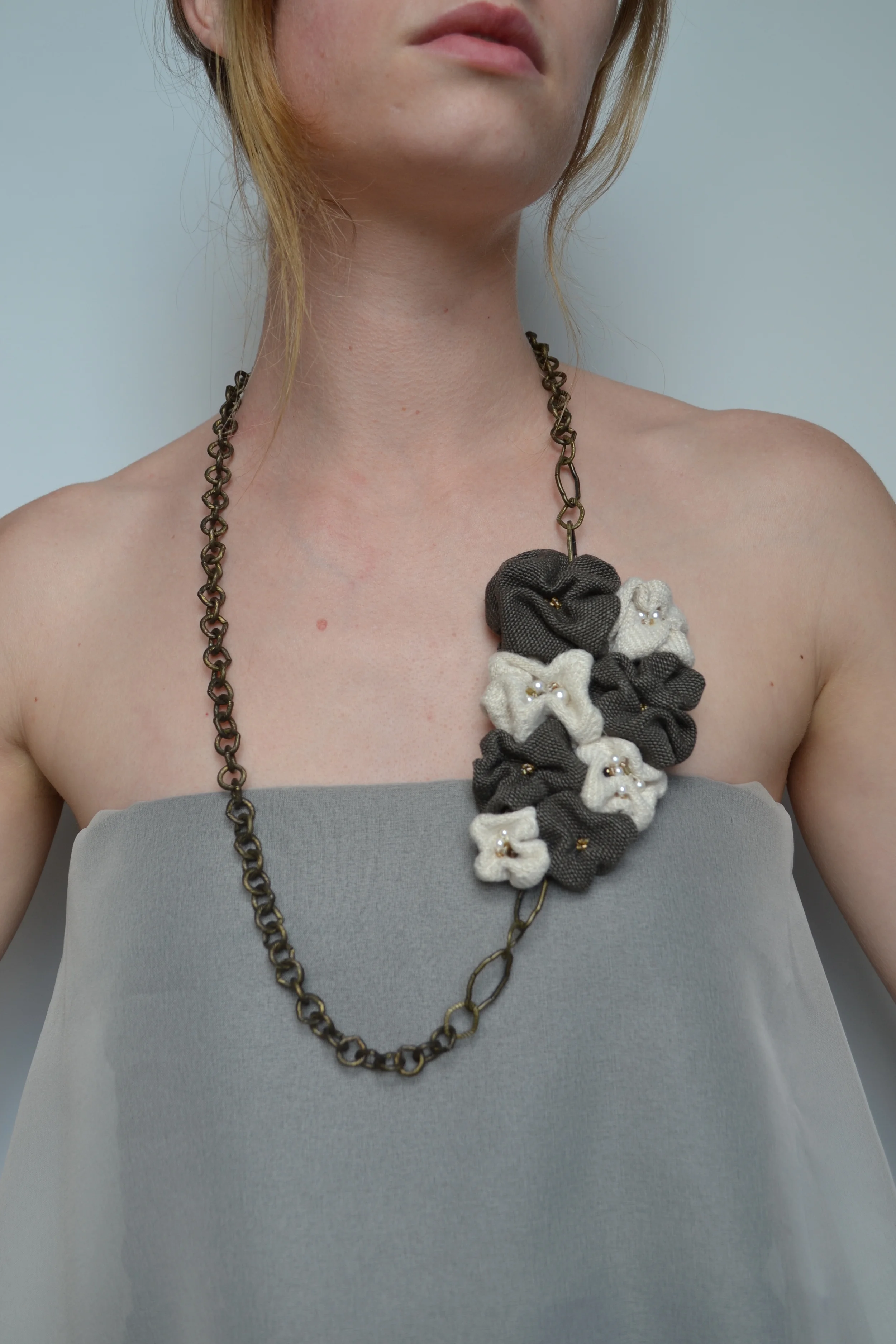 Bouquet style necklace from L.E.W. designs. Beige and grey fabric, featuring pearls. Hand sewn. Click through for more information..JPG