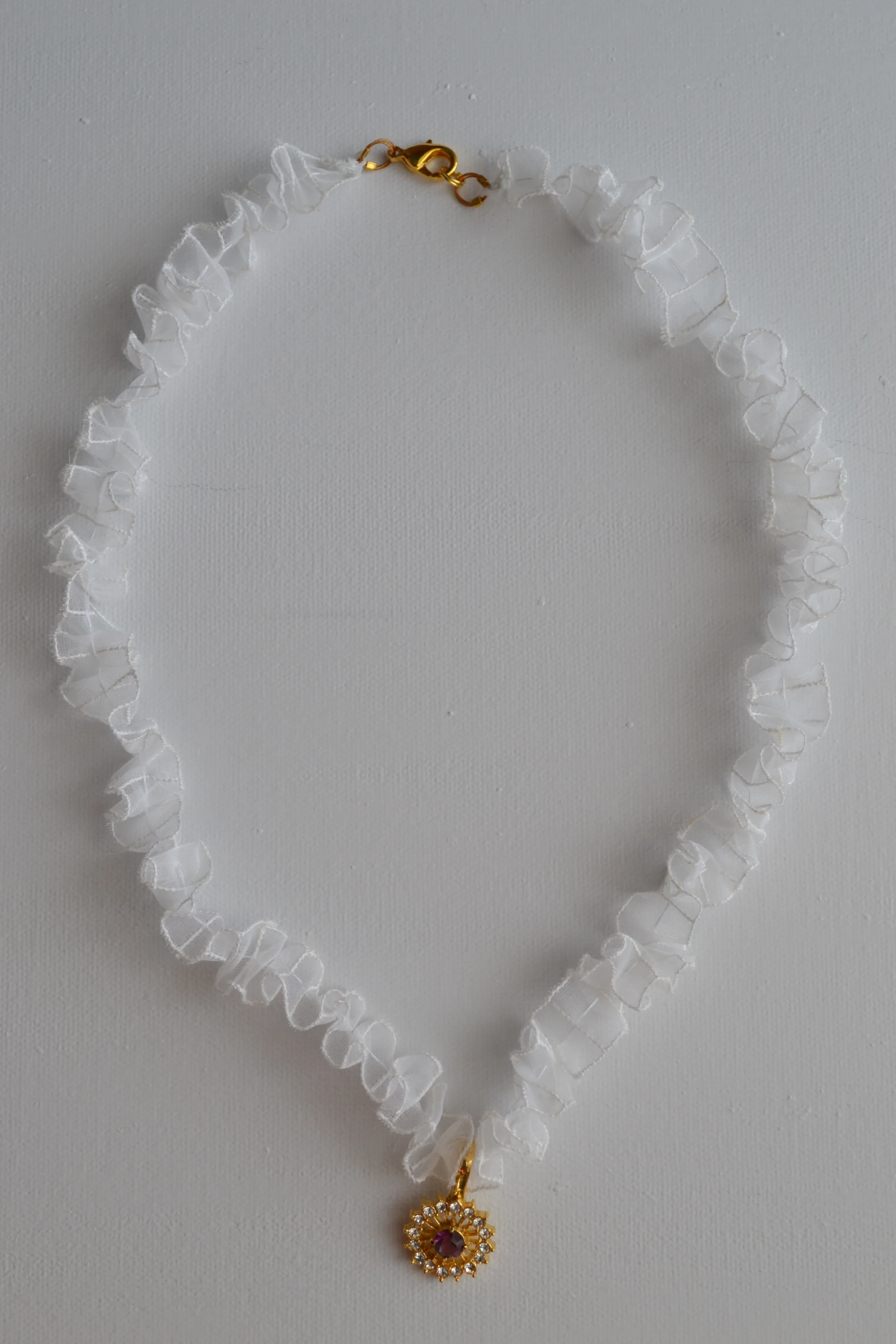 Fluffy white necklace from L.E.W. designs. Repurposed pendant with a purple stone.  Handmade. Click through for more (3).JPG