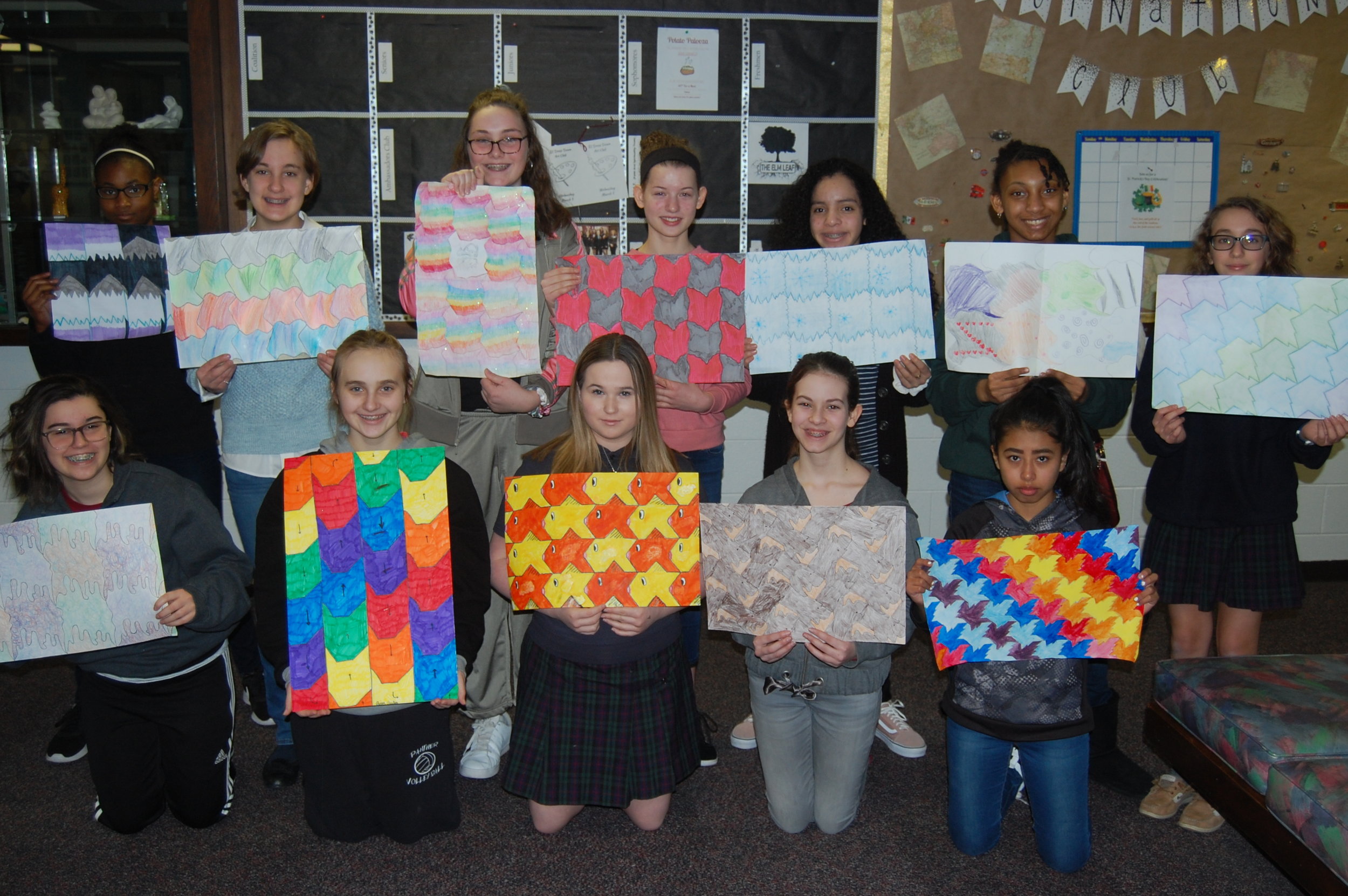 Elms Middle School students display their tessellation posters.