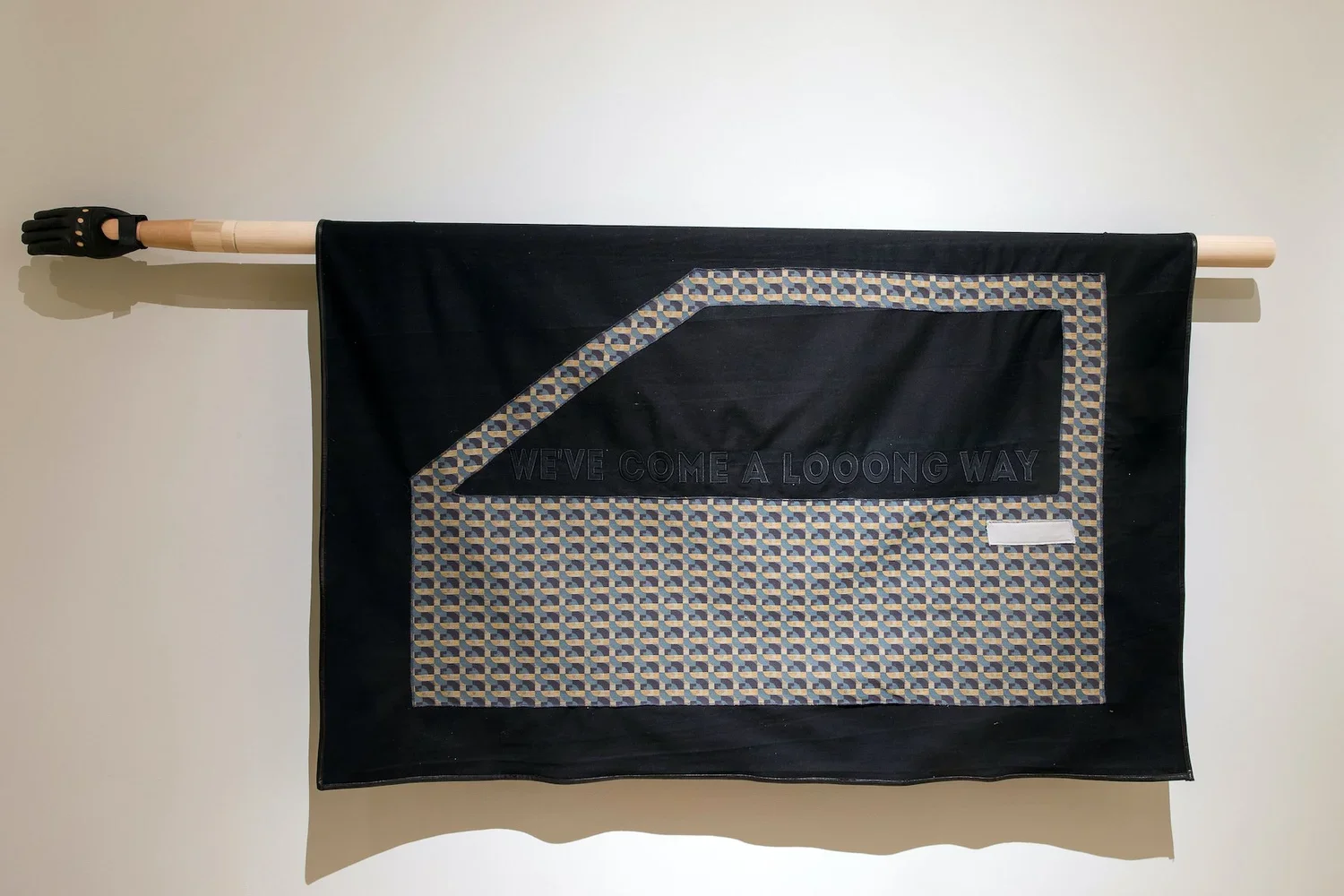  En Route 4: We've Come A Looong Way. 2018.  
 
Fabric, thread, leather, wood, and metal hardware. 40 in. x 85 in. From the “Sanctuary” series. 