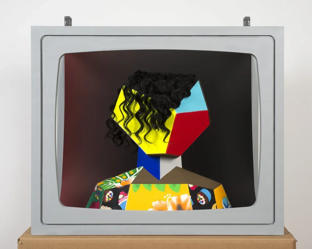  Boxhead 2. 2014.  
 
Mixed media sculpture. 23 in. x 28 in. x 19 in. From the “LIVE and IN COLOR” series. 