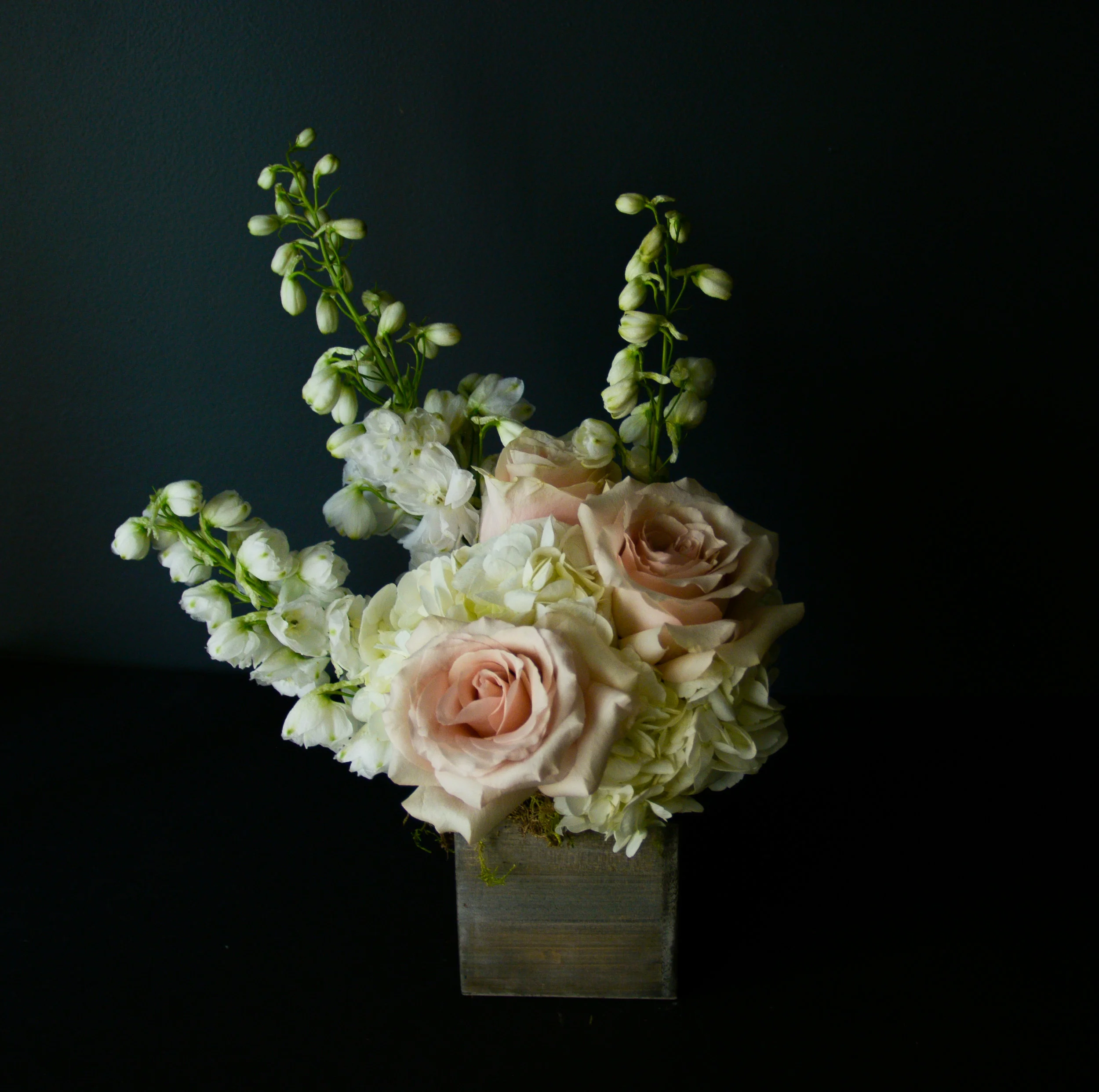 $50 Arrangement A brilliant flower and greenery filled gift, perfect for a small mantle-piece, cubicle or desk brightener, and countertop decor. Always packed with the prettiest blooms of the day, and ready for any occasion.
