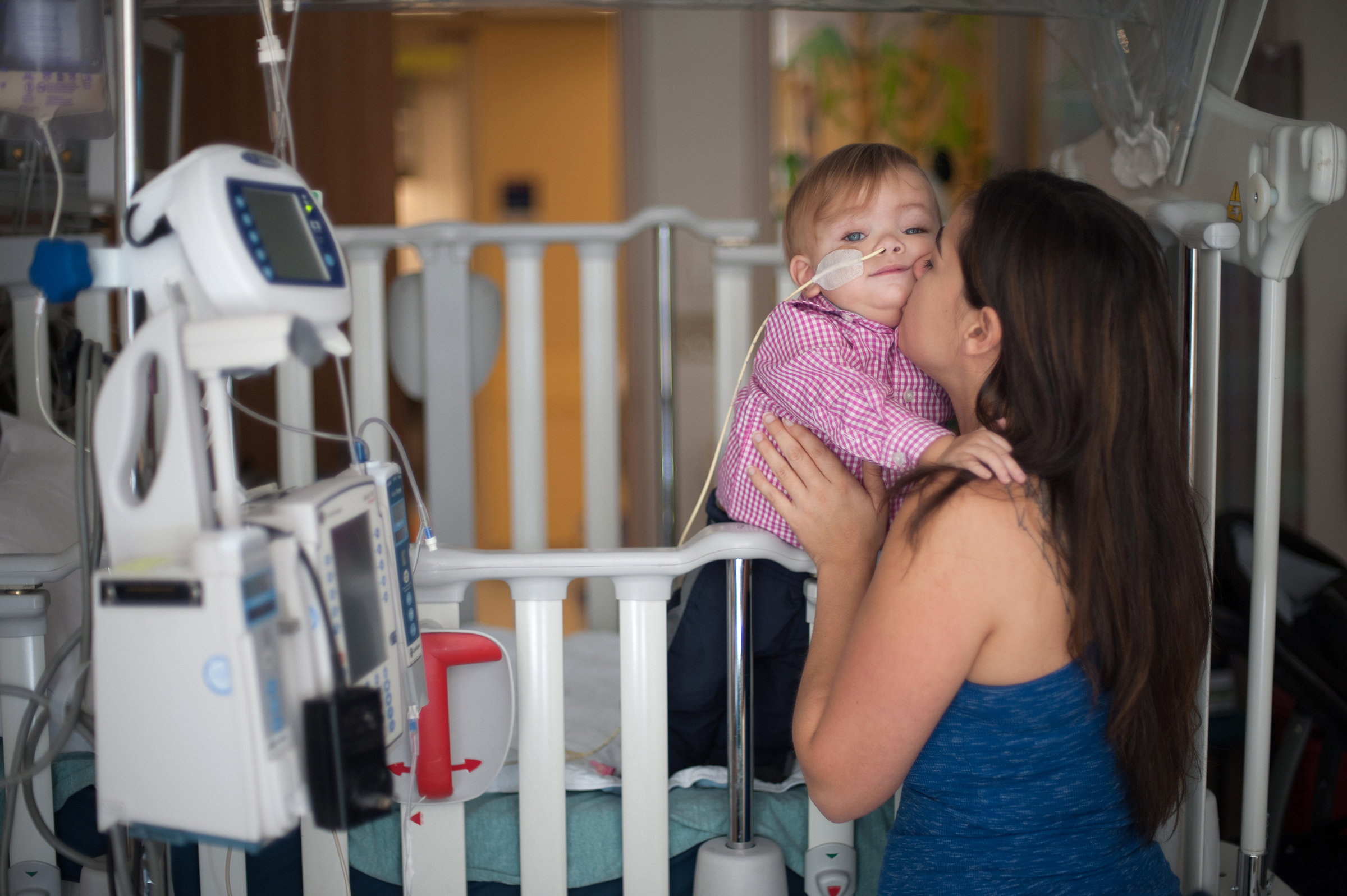Gavin embraces his mom in their hospital room.