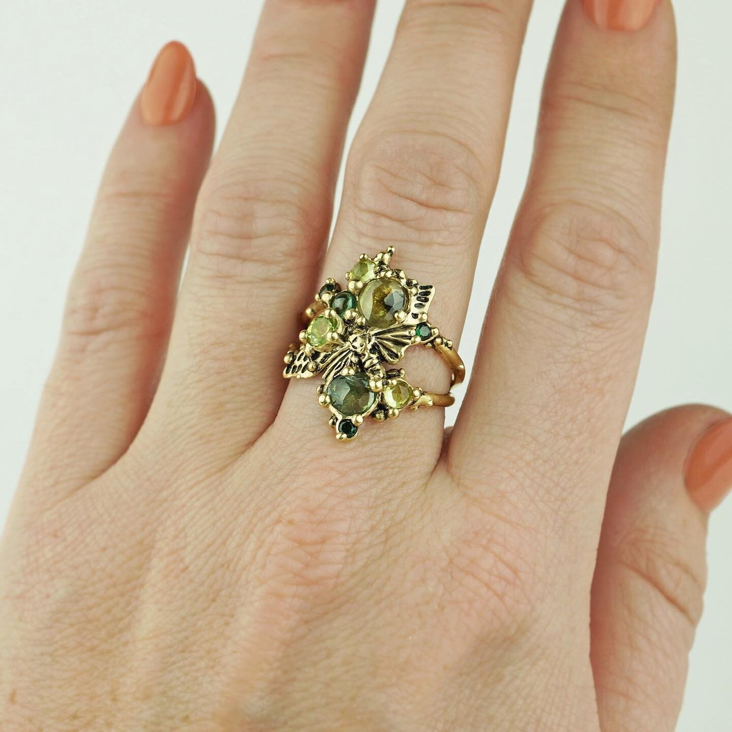 Today is your last chance to purchase items with a sale!
This cicada cluster ring is 14k solid gold and features tourmalines, peridots, and lab-grown emeralds. 💚🌿

&bull;
&bull;
&bull;
&bull;
#carriebilbojewelry #jewelry #handmadejewelry #rings #st