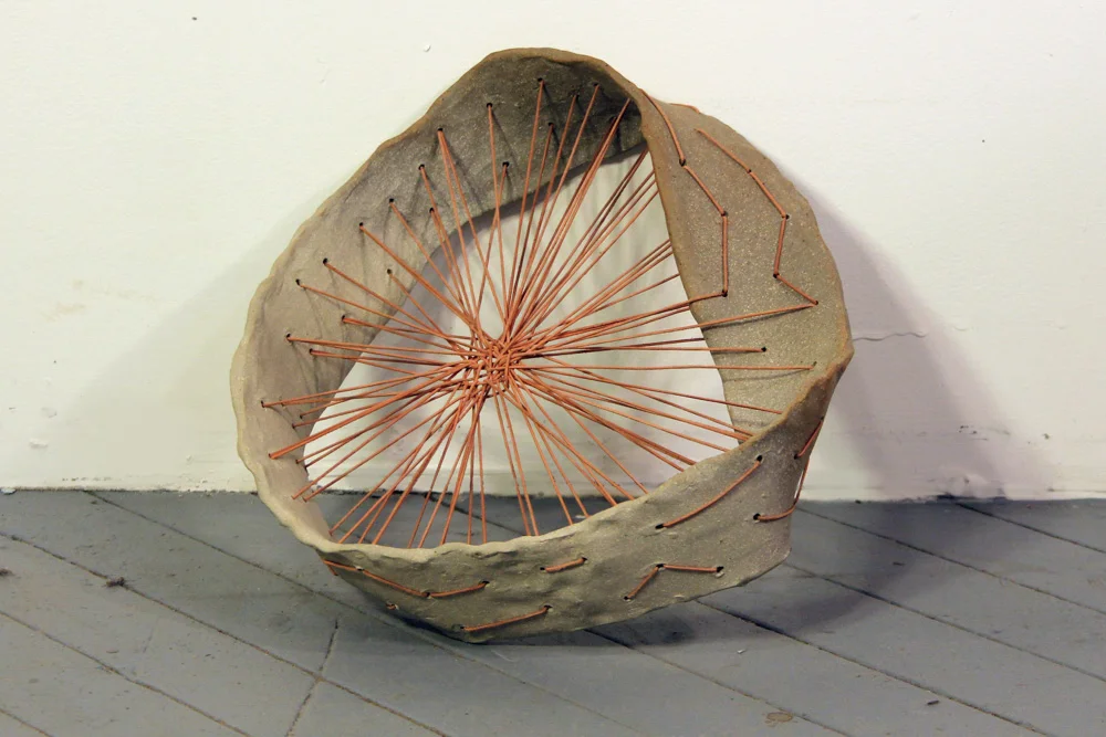 Mobius Strip Abacus #1 , 2011, Clay and leather, 14 x 11 x 6 in.