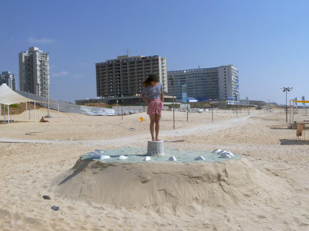Guy Ben-Ari and Leah Wolff, Time Loops - Human Sundial , 2011, Sand, plaster and acrylic paint, 5 x 14 x 14 ft Analemmatic sundial built collaboratively with Guy Ben-Ari. This project was commissioned by the city of Bat Yam, Israel during the summer of 2011. Artists and collaborators Guy Ben-Ari and Leah Wolff were invited to participate in Ocean Breeze, a public sculpture project in the city of Bat Yam, Israel. The resulting collaborative piece titled “Time Loops” referred to the ideas of Gilles Deleuze about repetition as part of the human experience, and the cyclical nature of our daily habits. The installation was meant to be used by the public as a human sundial, when the viewer standing in the center of the installation could tell the time according to the location of their shadow on the ground. The show was be open to the public from August through September 2011.