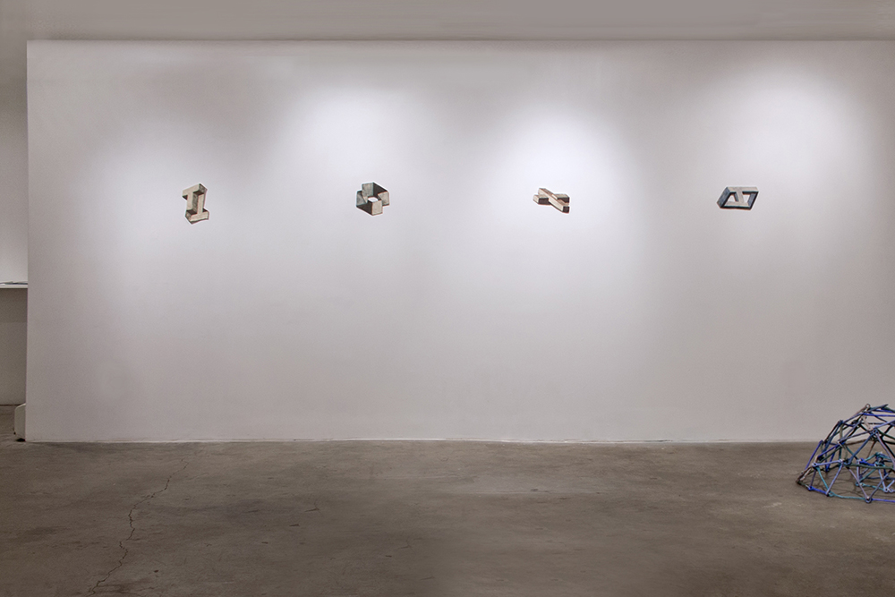 Impossible Shapes , 2013, installation view, Scaramouche, New York An impossible object is a 2-dimensional figure, which is instantly interpreted as a representation of a 3-dimensional object. Upon further inspection, we see that it is not geometrically possible for such an object to exist. This creates a contradiction, between what we perceive and what we know to be true, leaving the viewer in a state of Aporia. My practice deals closely with the cognitive dissonance that occurs at moments where our mind fluctuates between intuition and logic. I want my work to exist in the superposition of these two states, so that this mindset can lead us to a higher understanding of the subject. By definition, an impossible shape is one that can not exist in real space, so to look at it is always confounding. In this series, I work directly within these spaces, to try to realize something that is unrealizable.