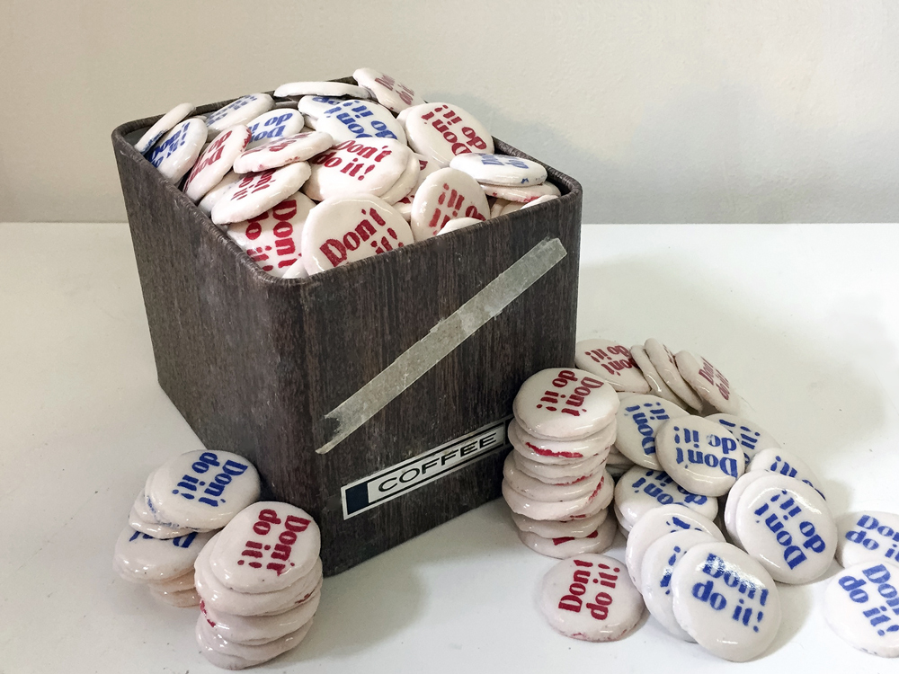 Don't Do It , 2016, glazed ceramic, 1.5" x 1.5" x 0.25 in. each