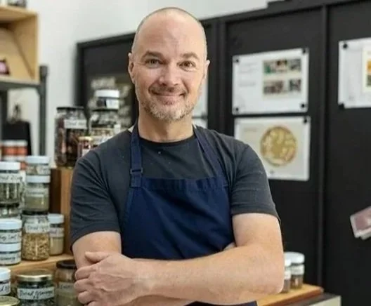 Tobie Puttock in a professional kitchen environment, developing circular food systems and sustainable kitchen practices.