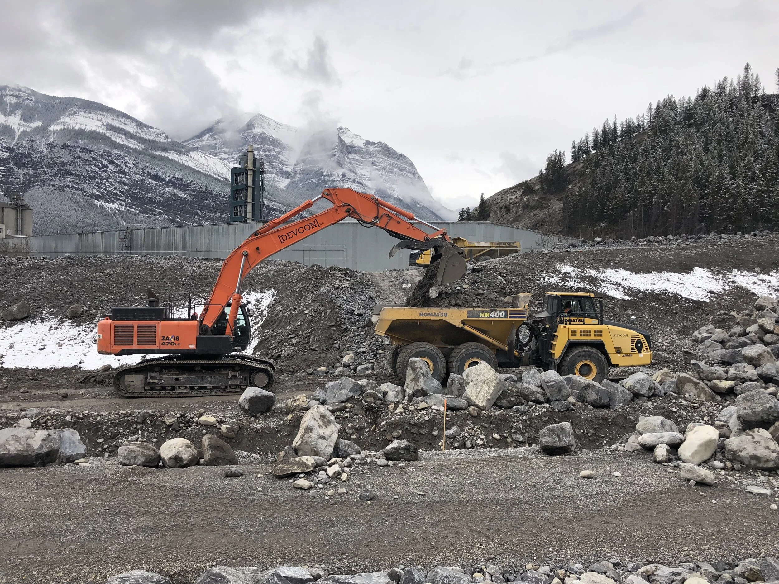 Excavator and truck at work