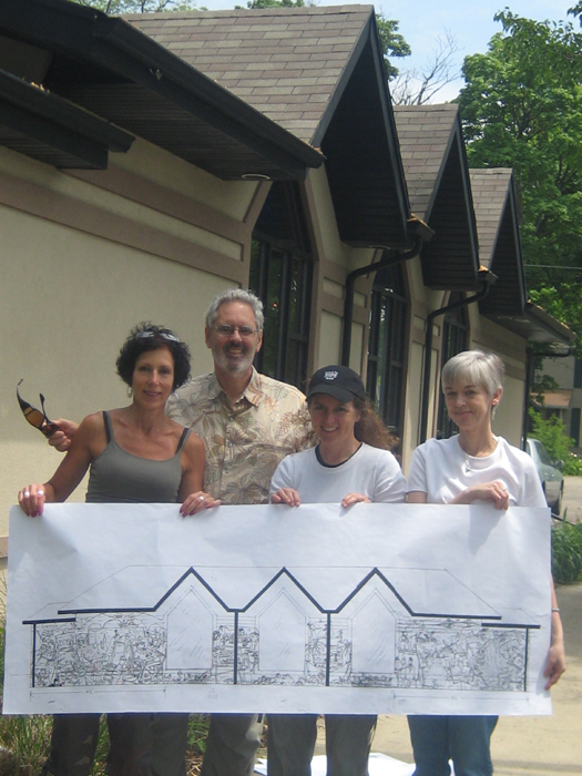 Mike is pictured with the Mural Committee before work begins.