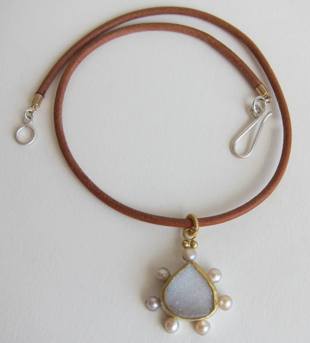 Druze agate pendant set in silver and gold