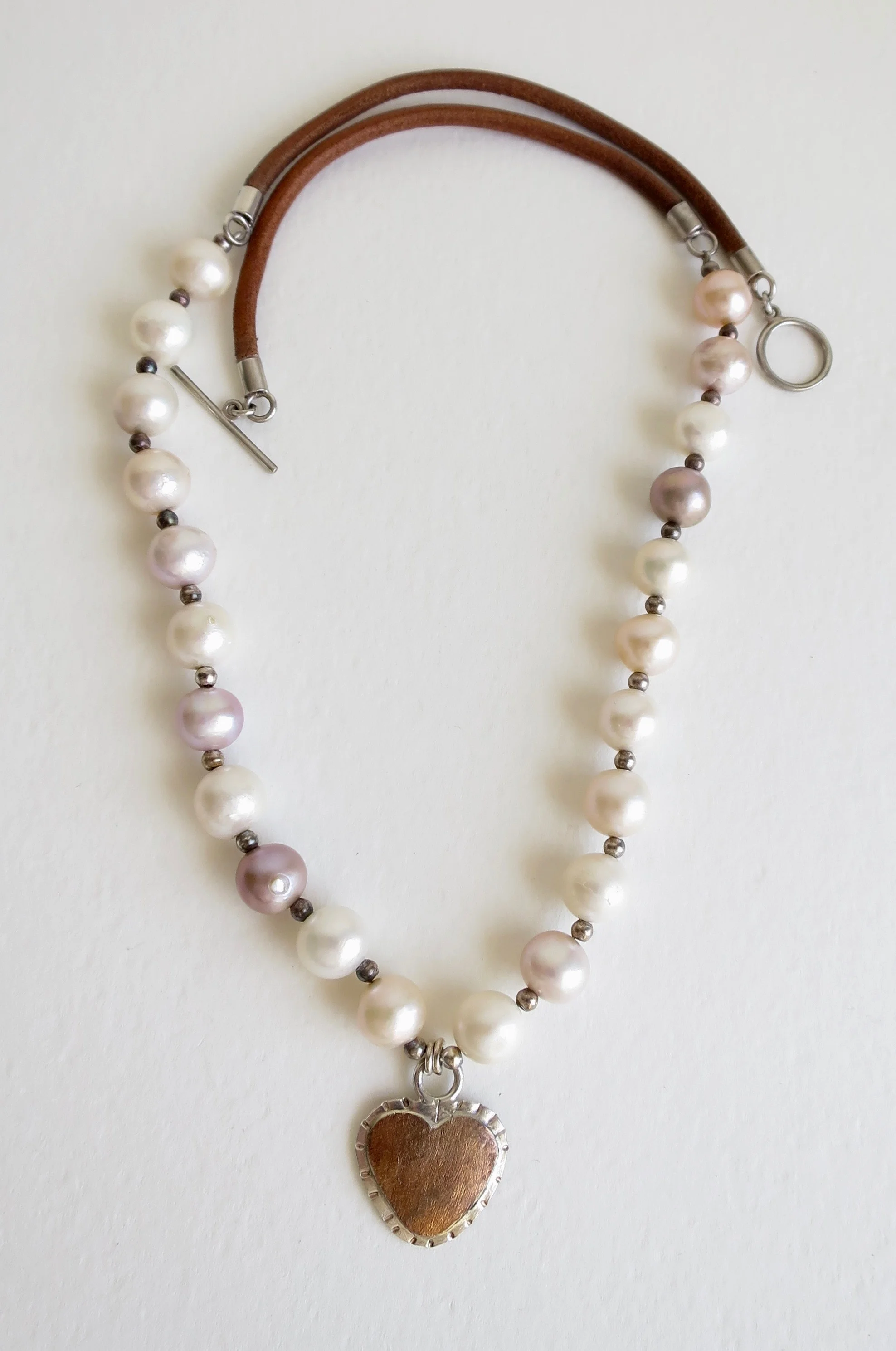 Pearl necklace with Silver and 14kt gold heart drop