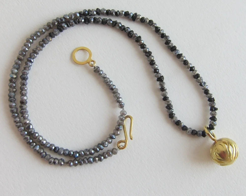 Rough diamond necklace with gold pendant 