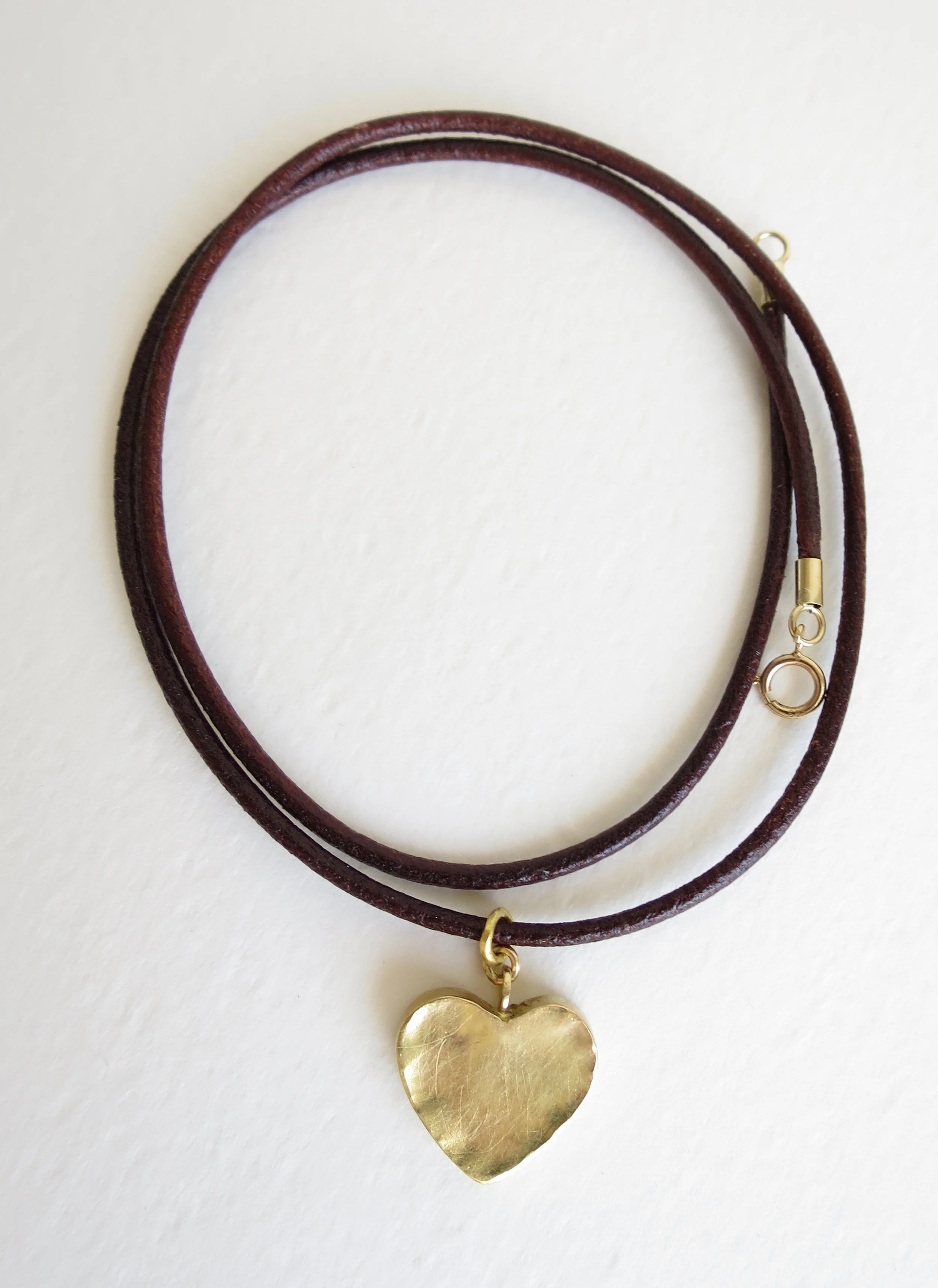 18kt Gold heart on leather thong 