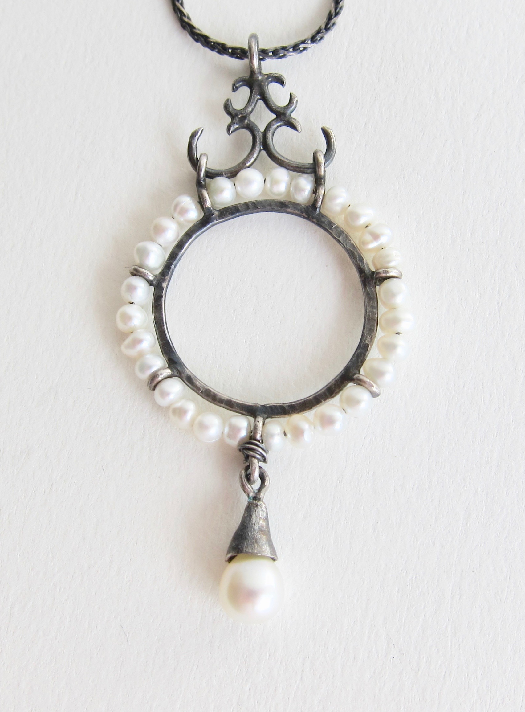 Jewelry Jewellery Oxidised silver disc with white pearls and one pearl drop, setting Oxidised silver