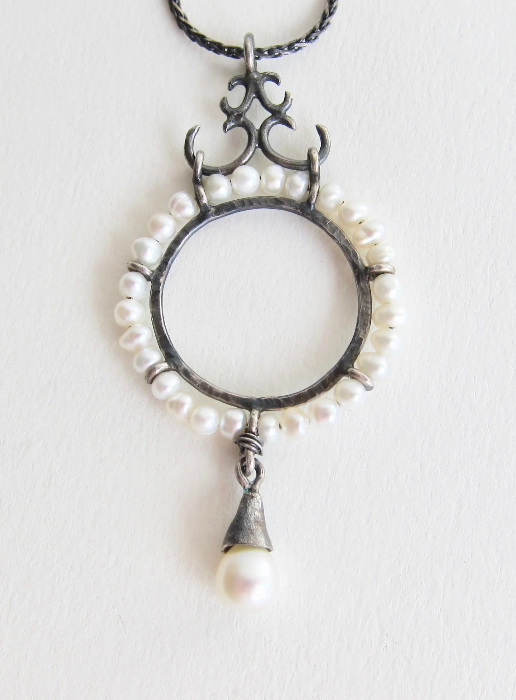 Oxidized silver disc with Pearls