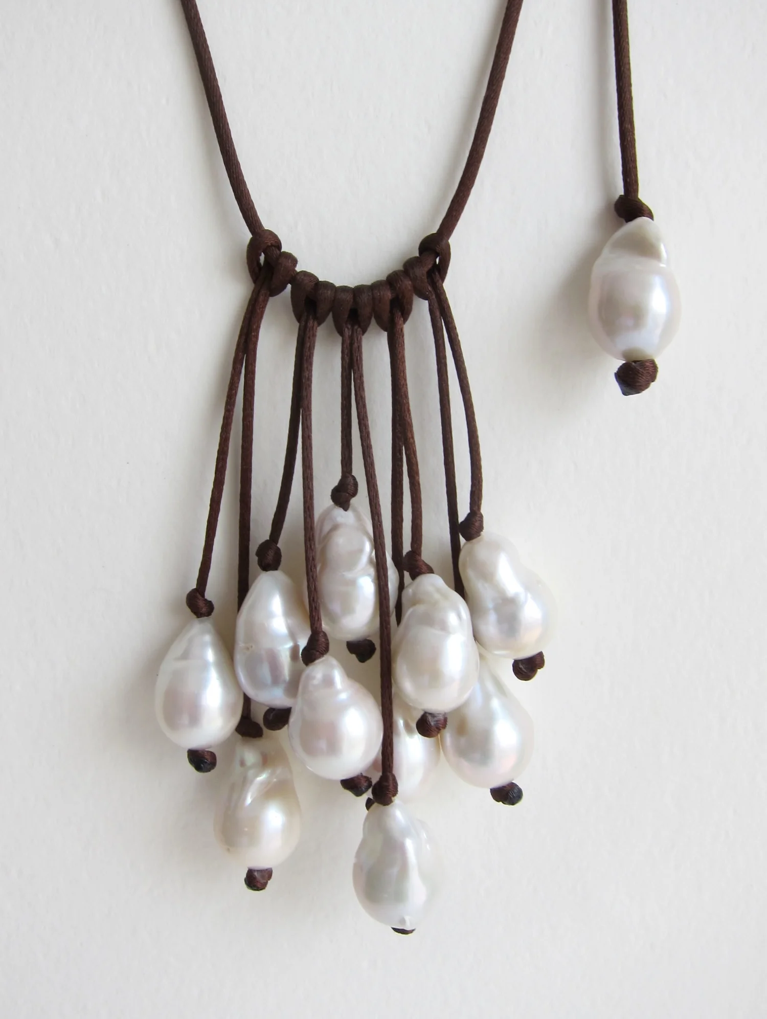 Cascade of Pearls on Blue Satin