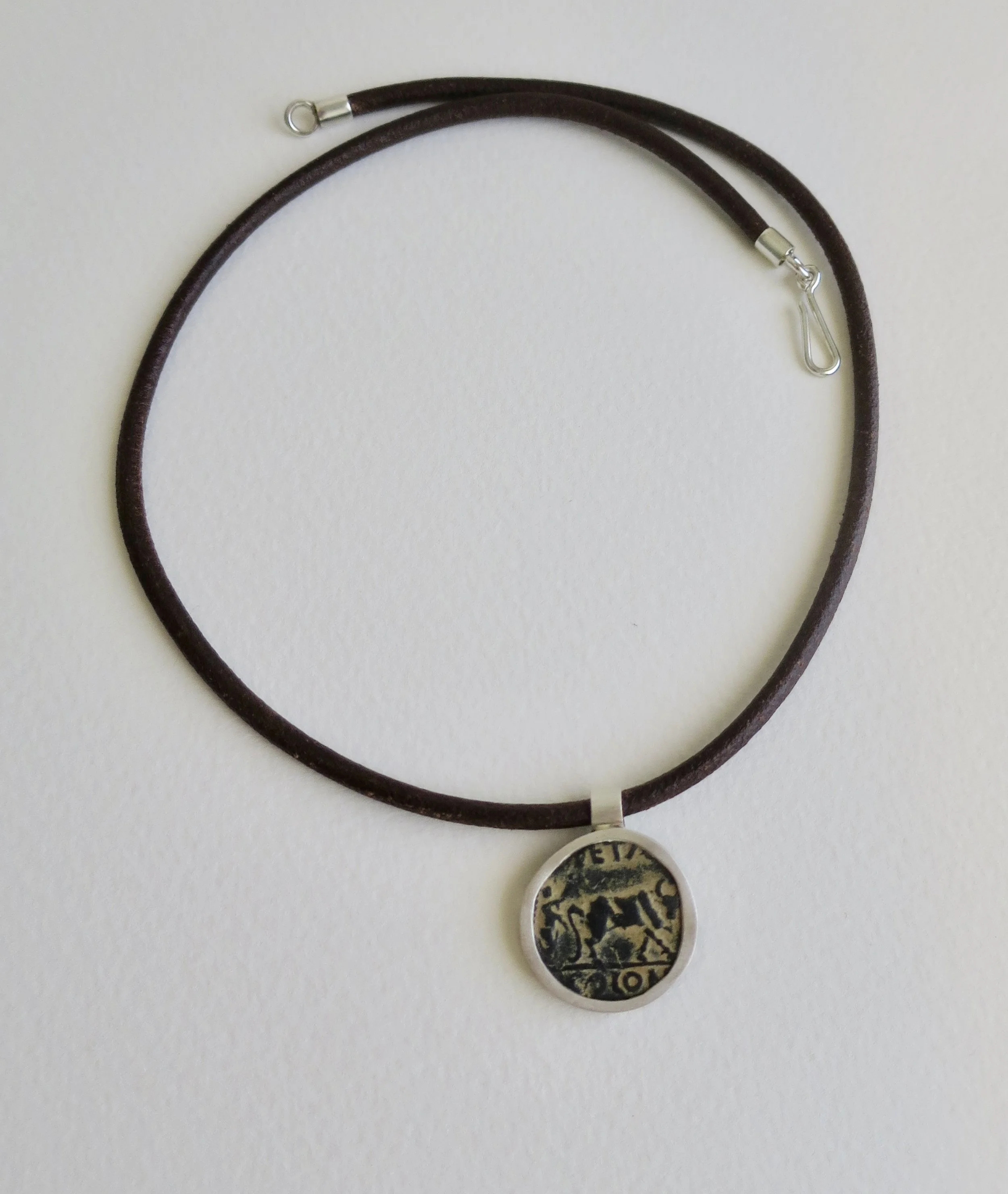 Bronze Petra coin set in silver pendant