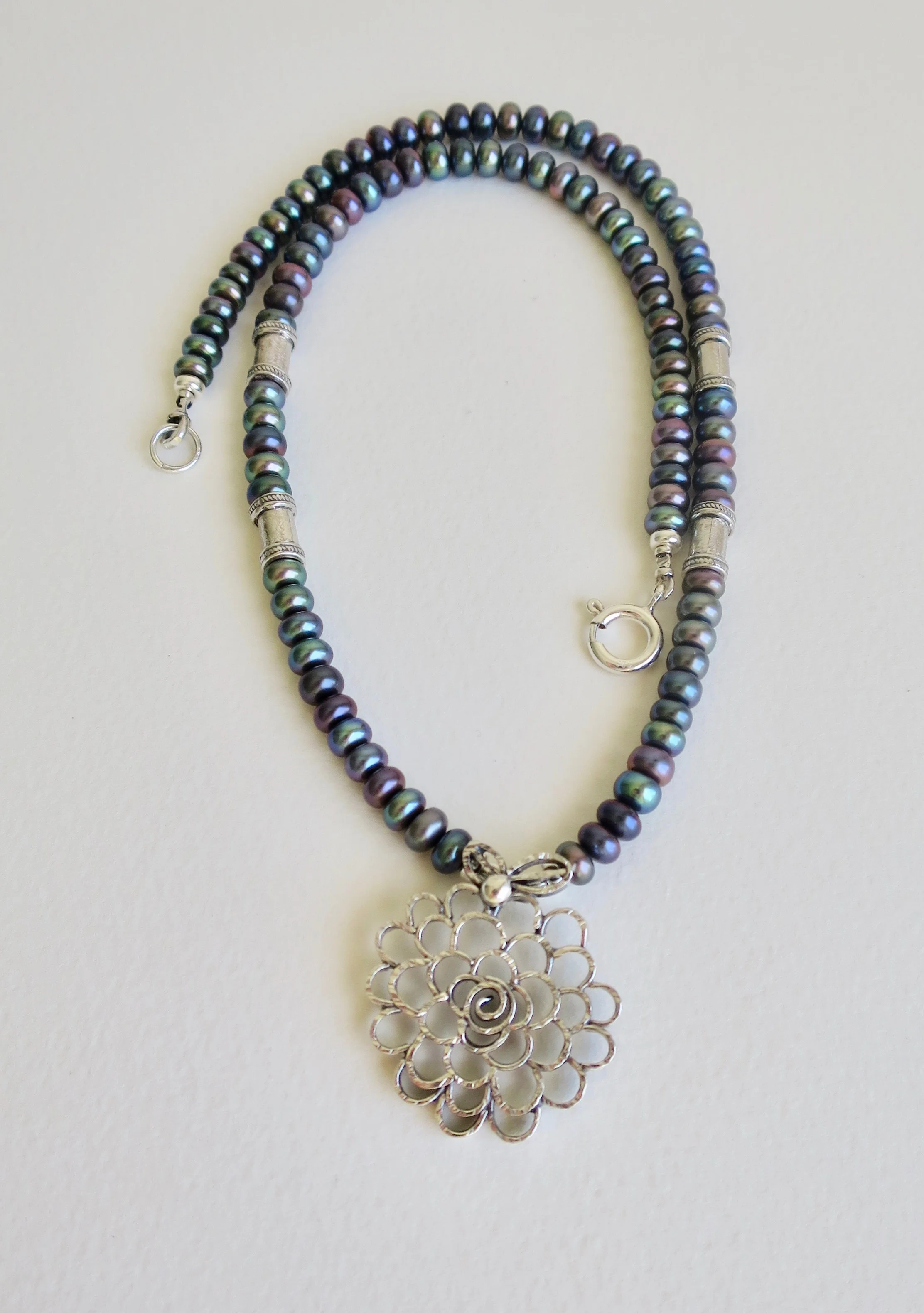 Pearl necklace with Rose silver pendant.