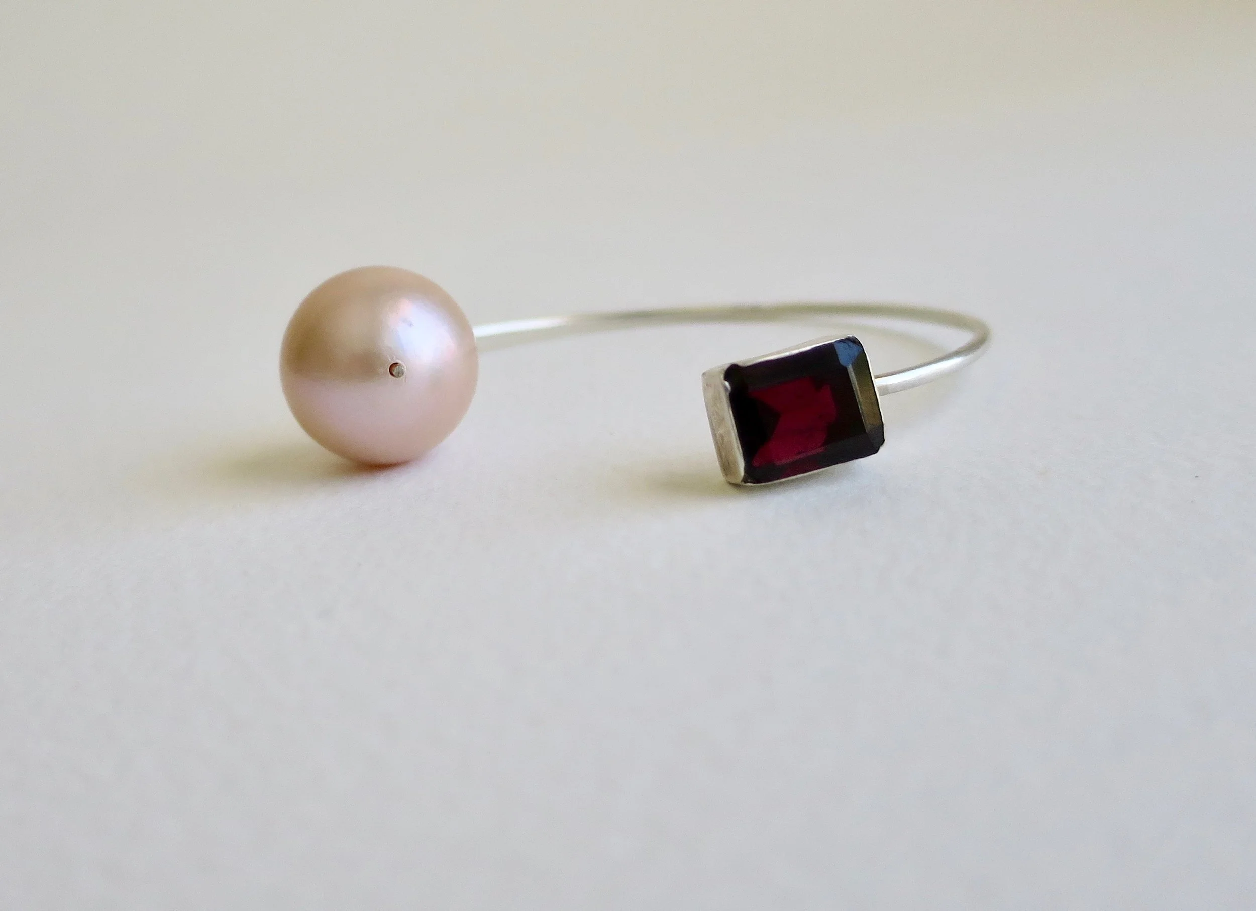 Silver open bangle with Garnet and Pink Pearl