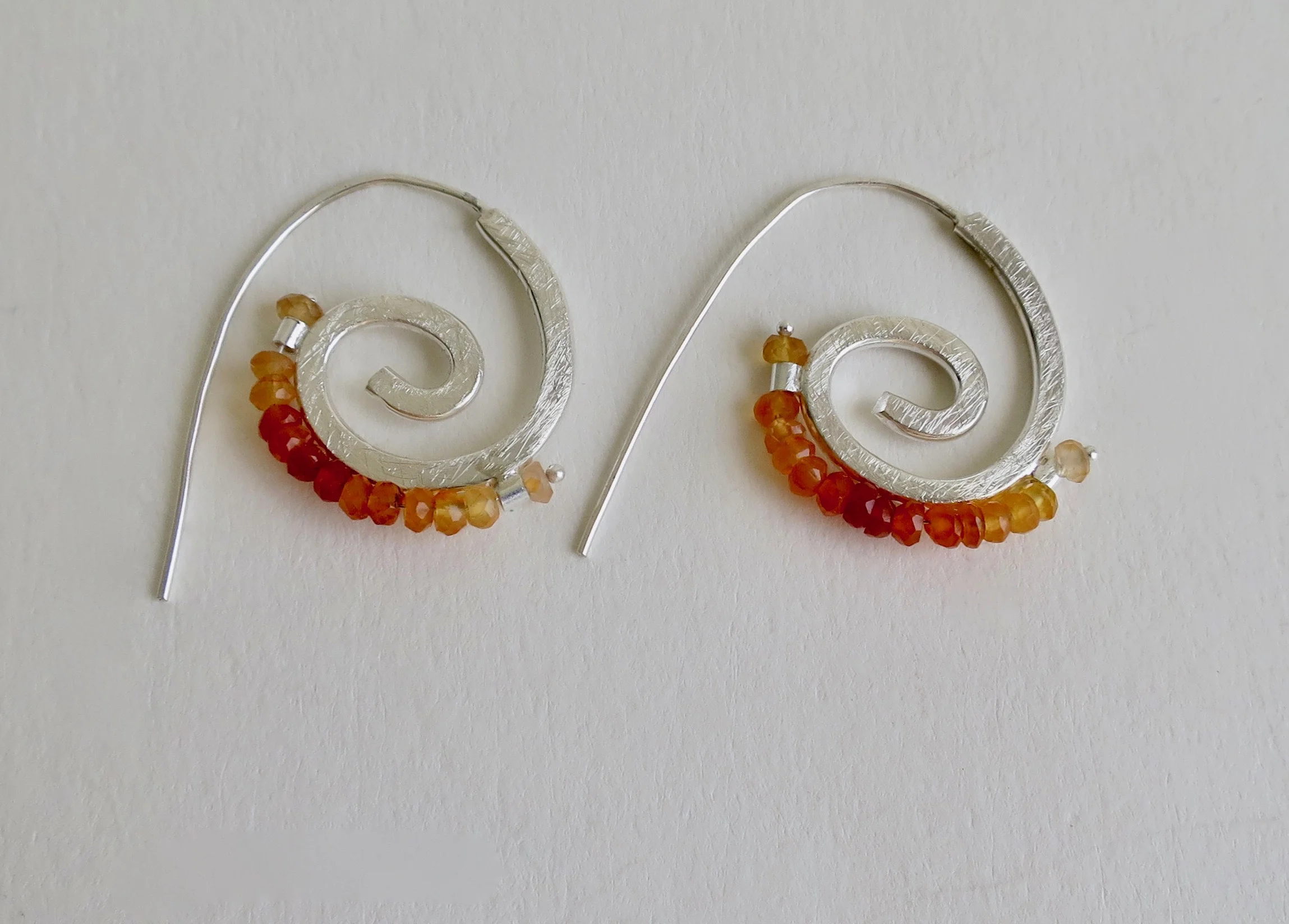 Spiral silver earrings with Carnelian