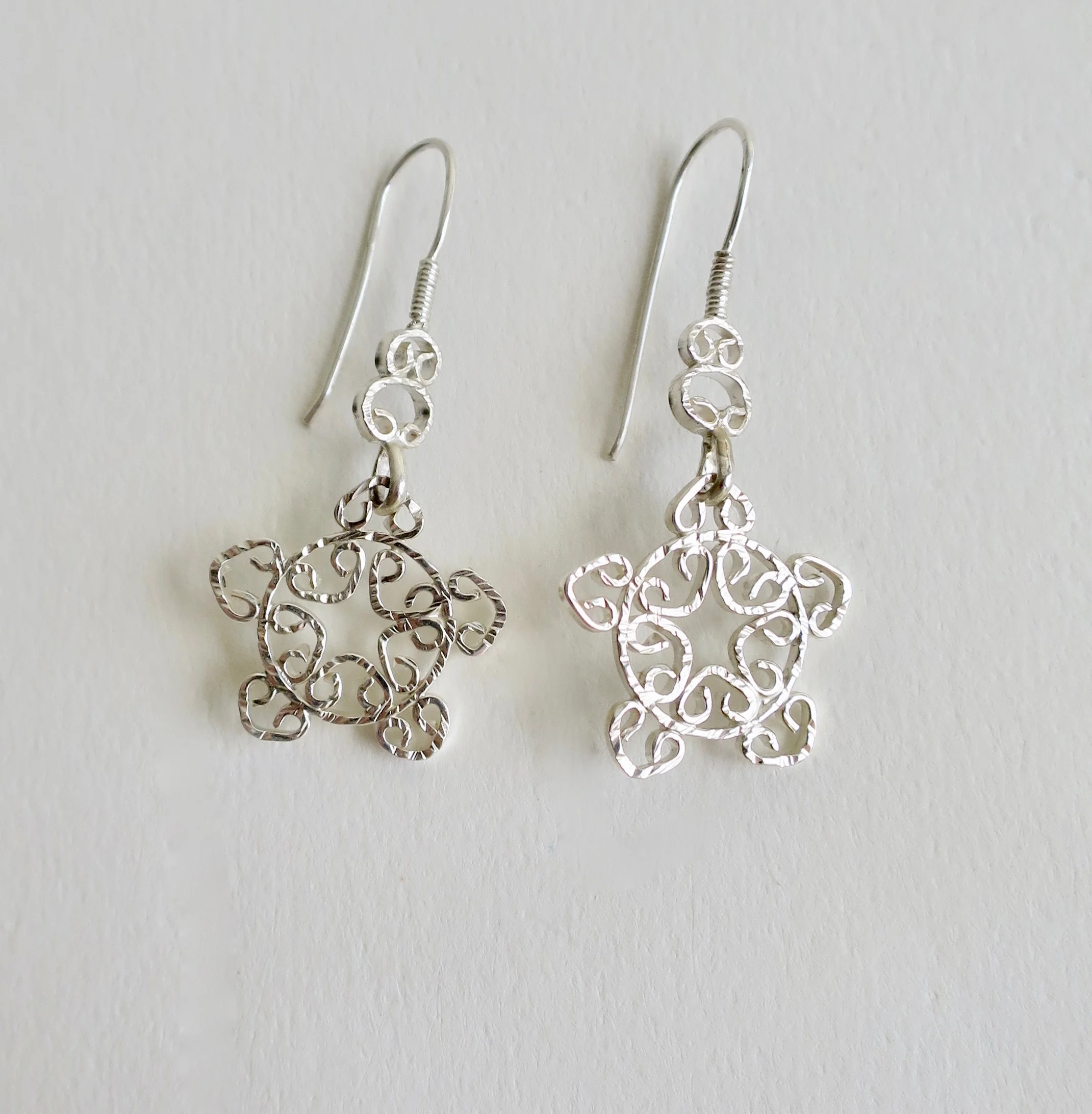 Silver 'snow' design handmade earrings