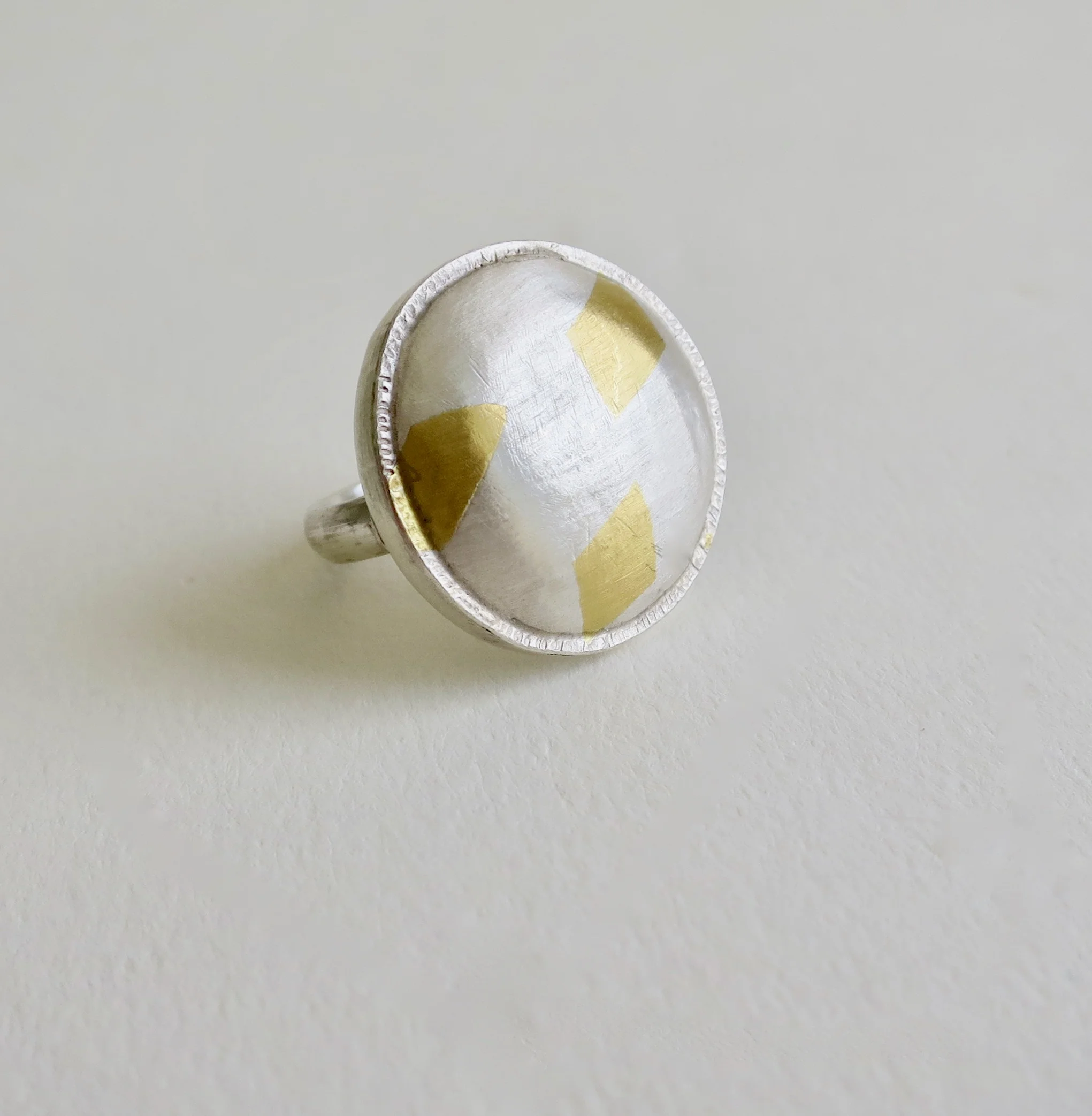 Fine silver ring with 22kt gold