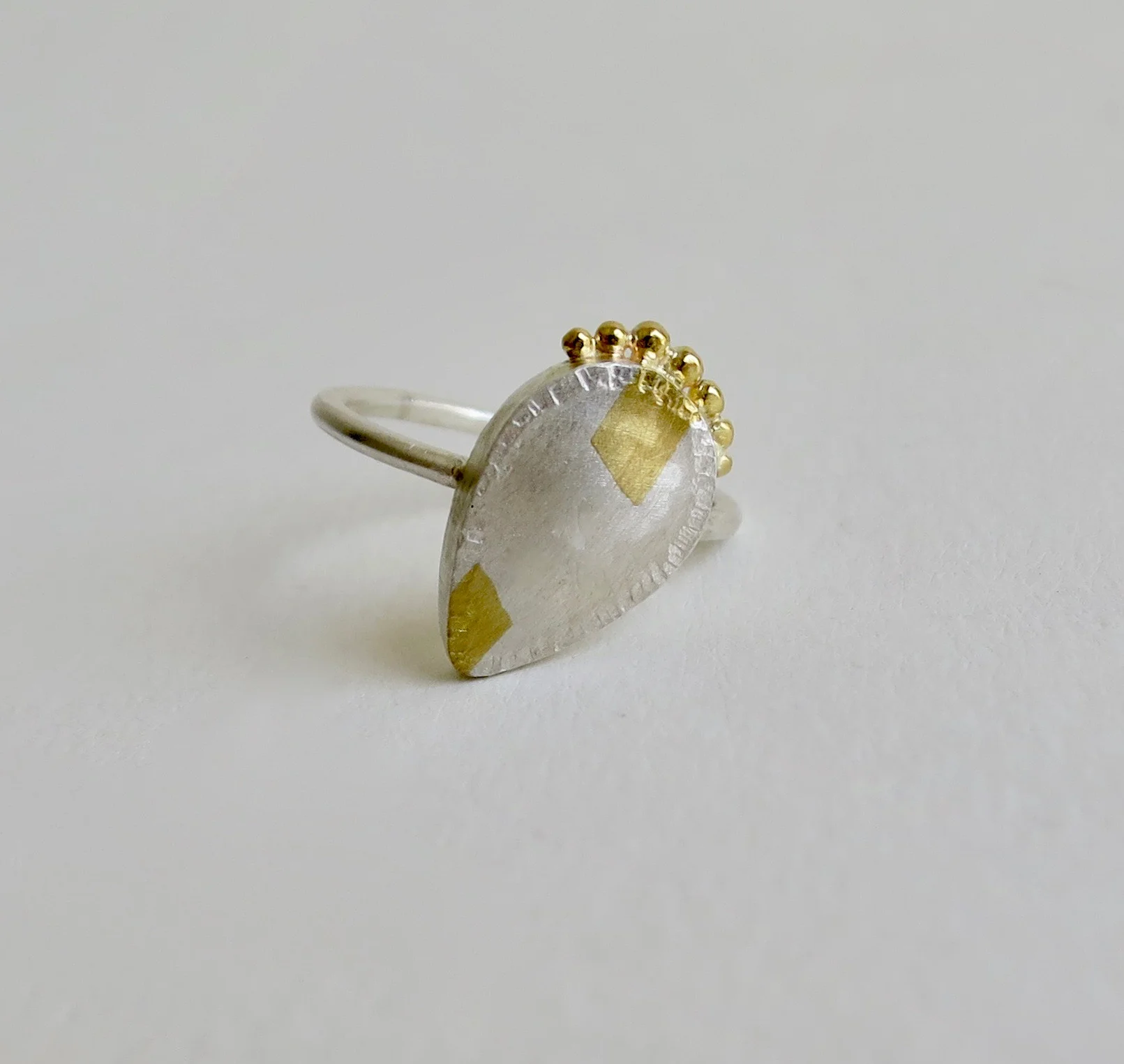 Fine silver ring with 22kt gold