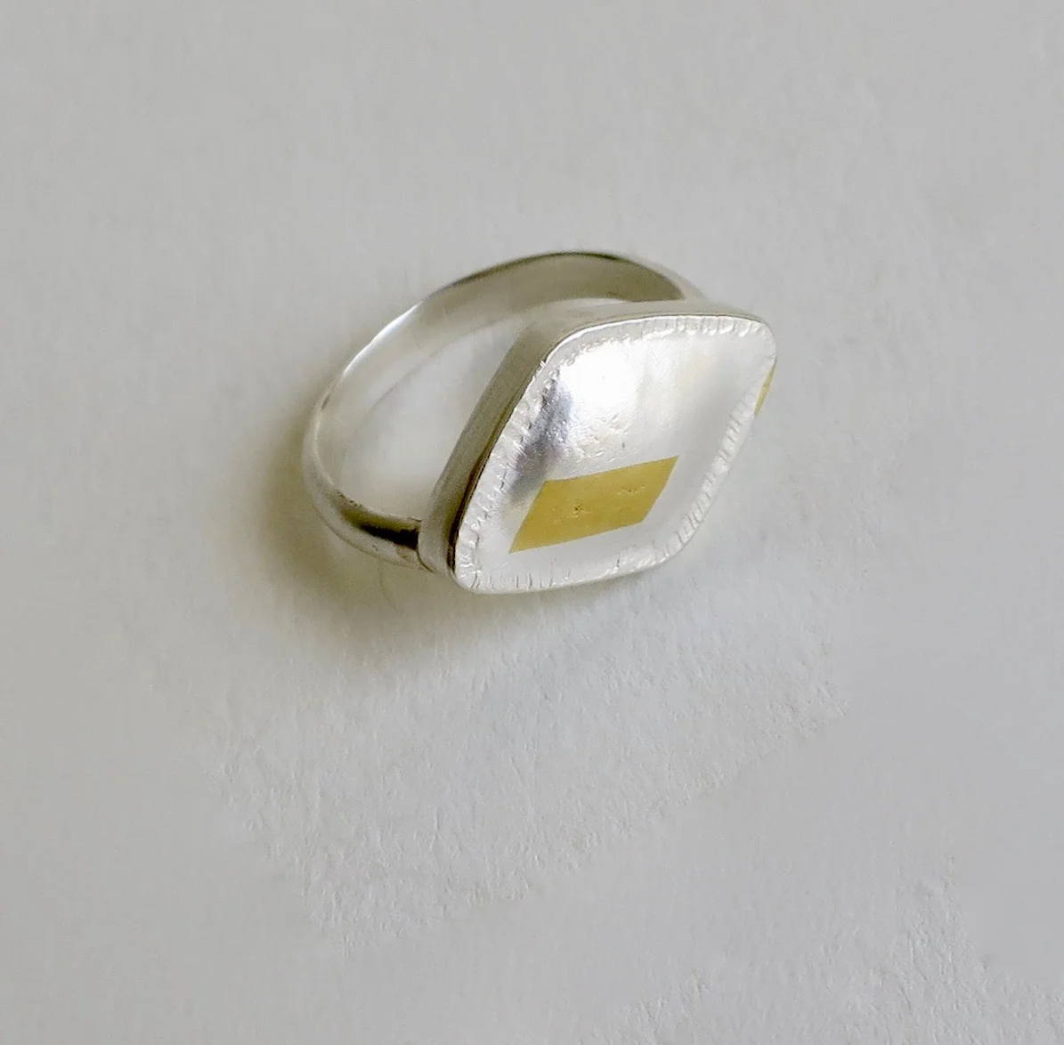 Fine silver ring with 22kt gold