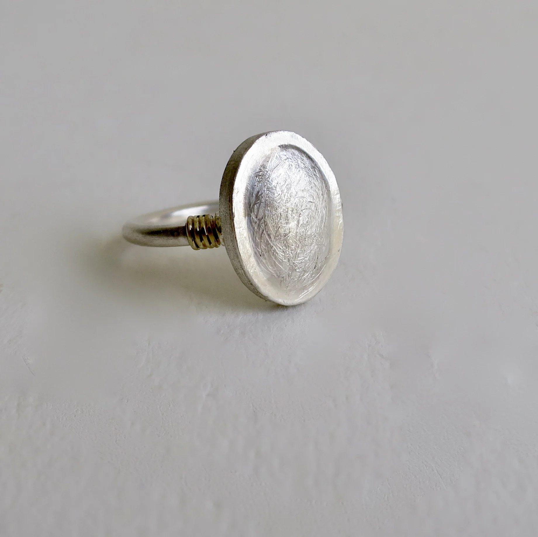 Fine silver ring with 22kt gold