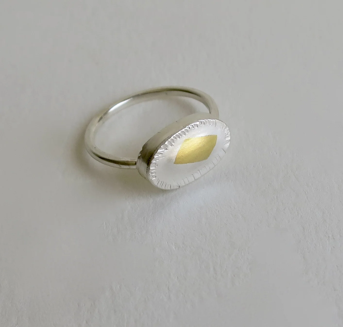 Handmade fine silver ring with 22kt gold