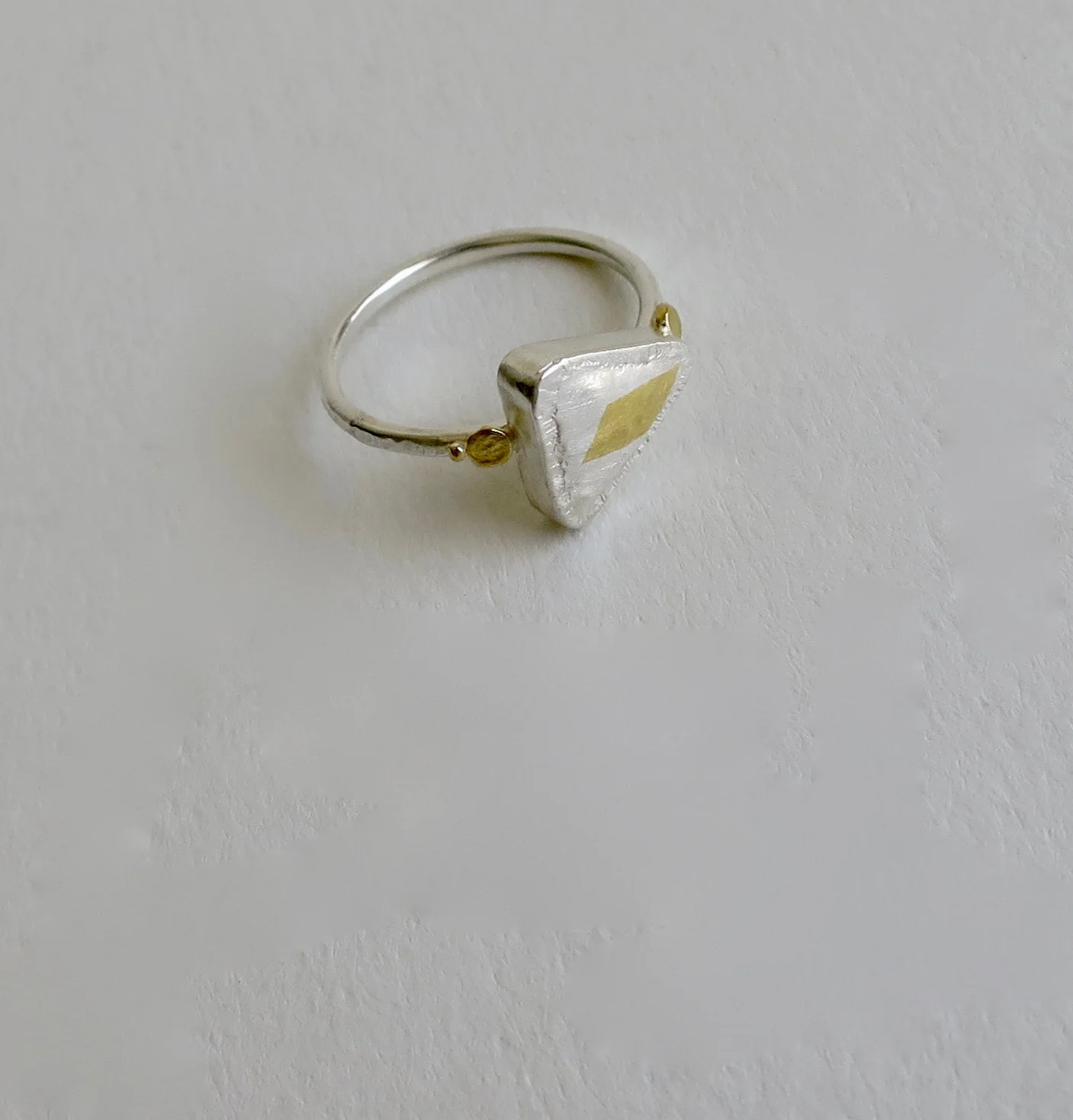 Triangular shaped fine silver ring with 22kt Gold