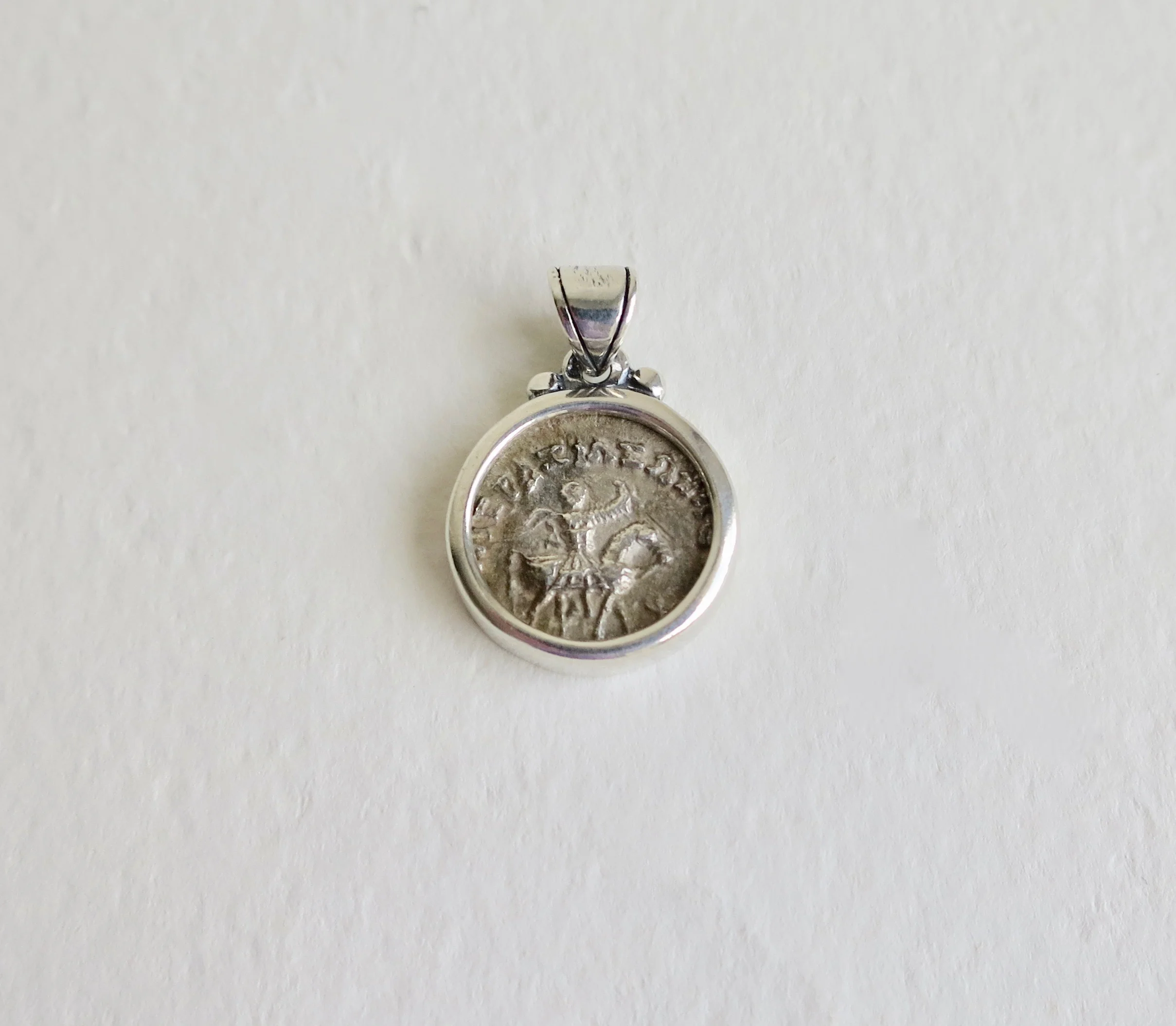 Silver coin of Azes 11 set in silver pendant