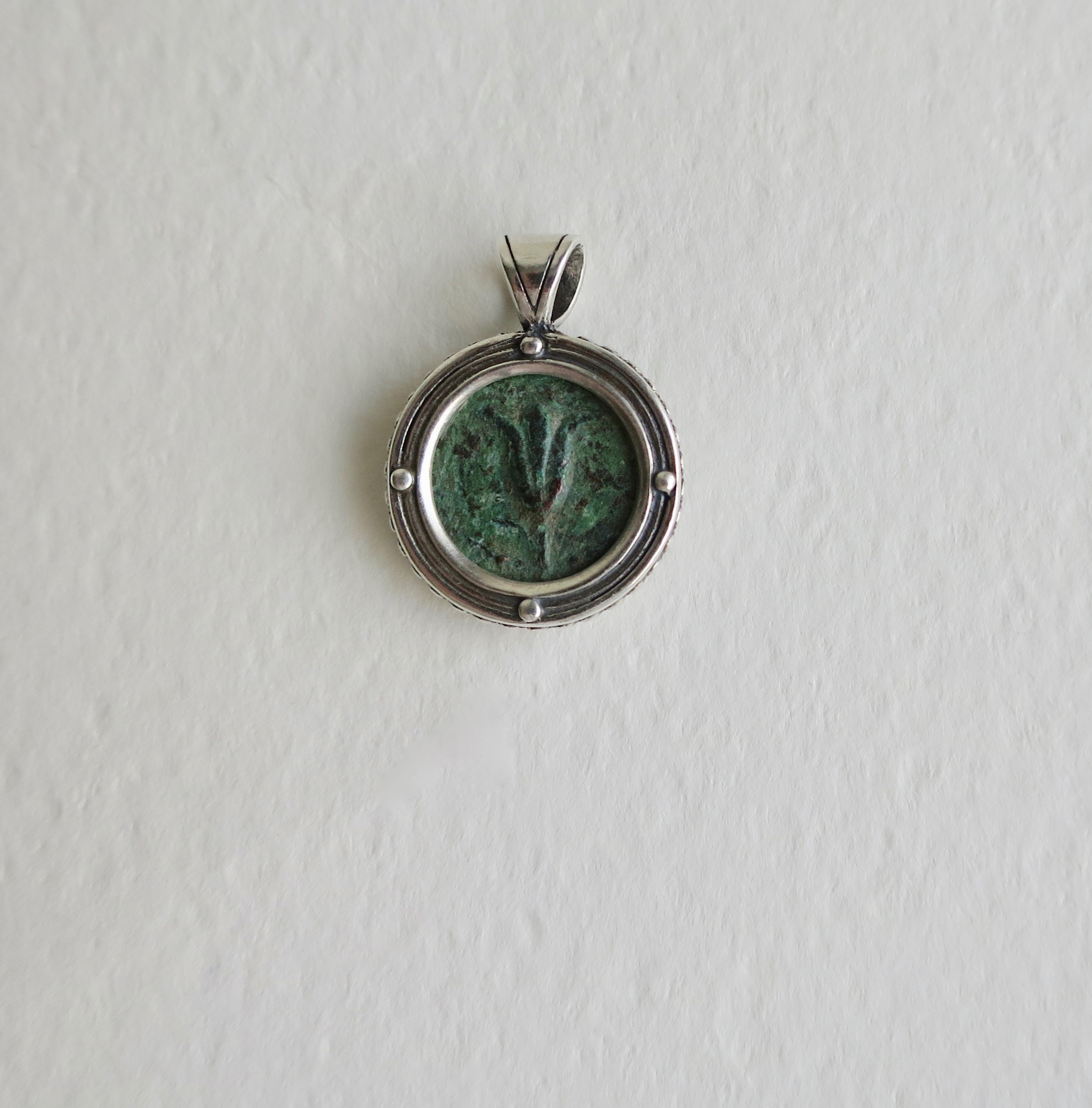 Lily of Jerusalem coin set in silver pendant