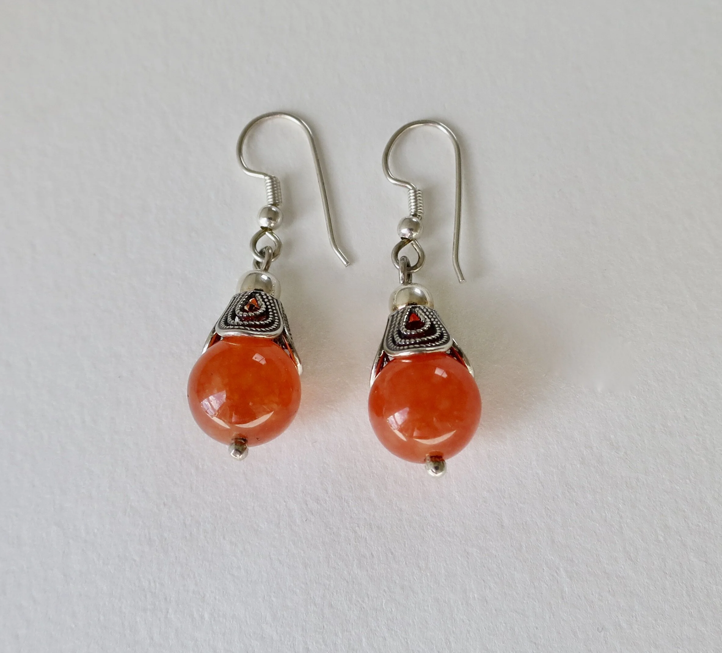Silver filigree earrings with orange carnelian stones