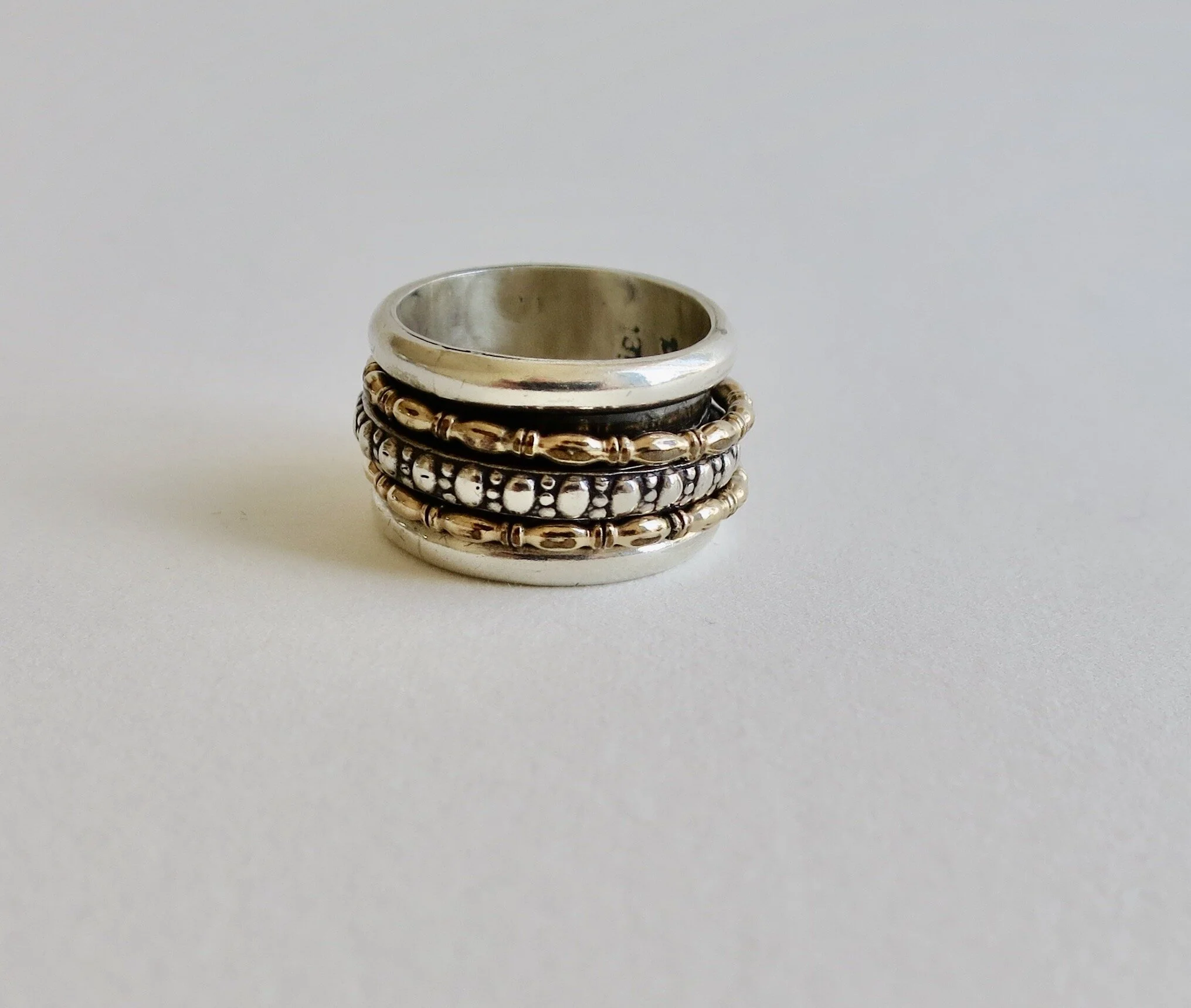 Silver filigree band with moving elements, silver and vermeil