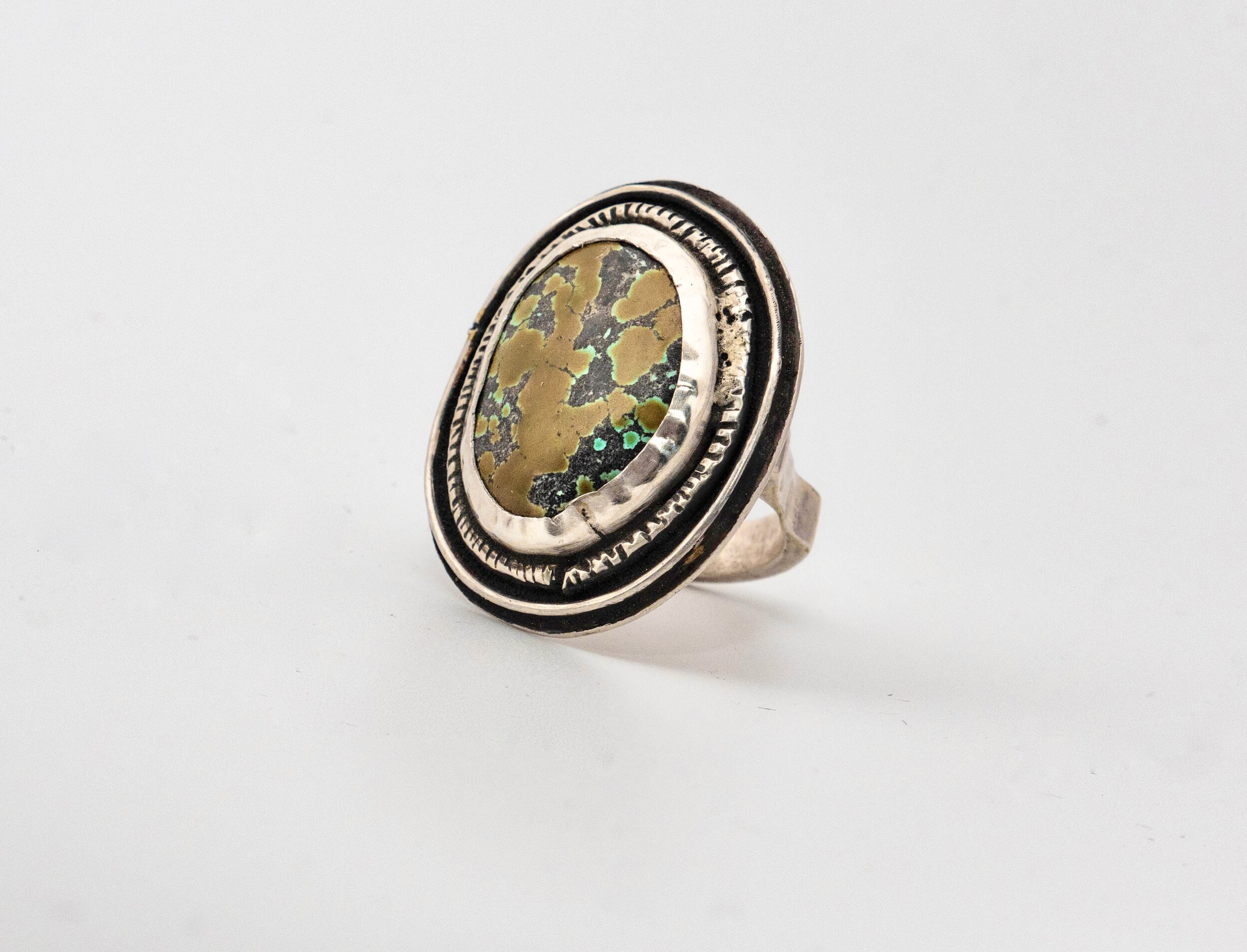 Exquisite Turquoise set in handmade silver ring