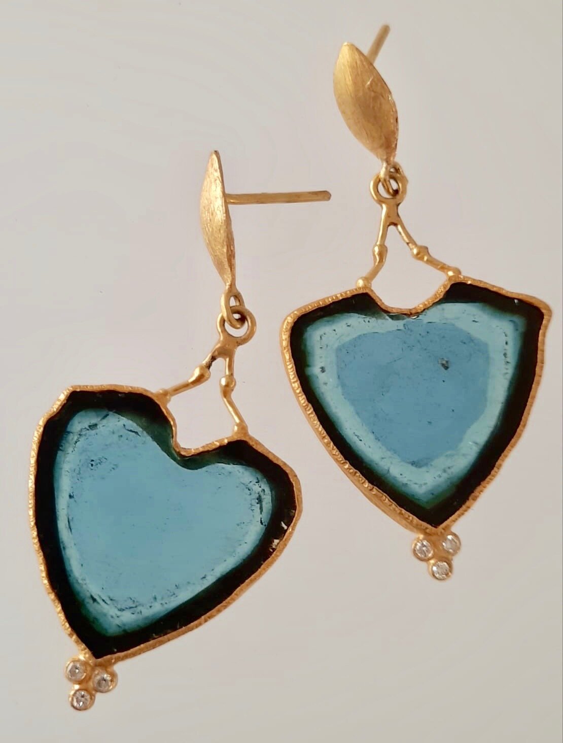Blue Tourmaline set in 24kt and 18kt gold with diamonds