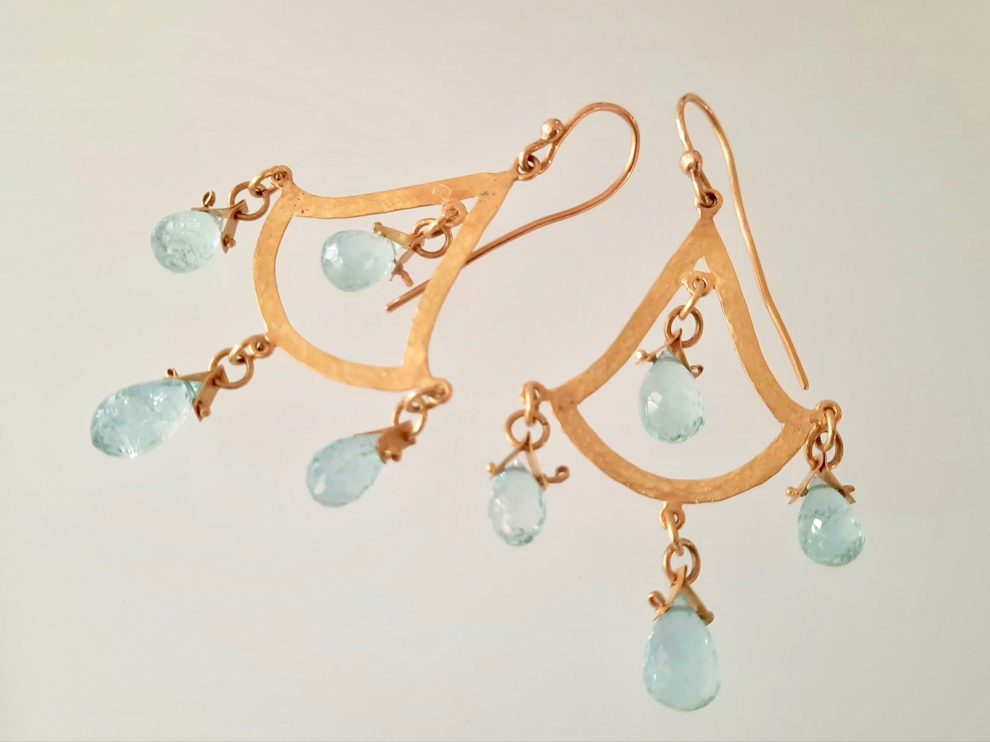 Elegant gold earrings with Aqua Marine drops