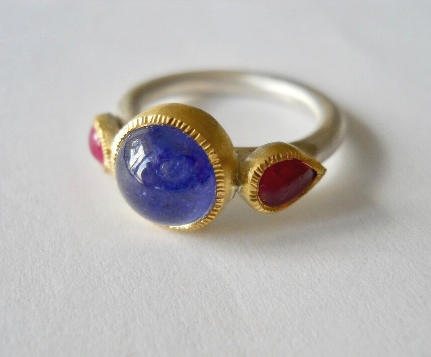 Tanzanite and Ruby ring, set in 22 carat gold with silver band