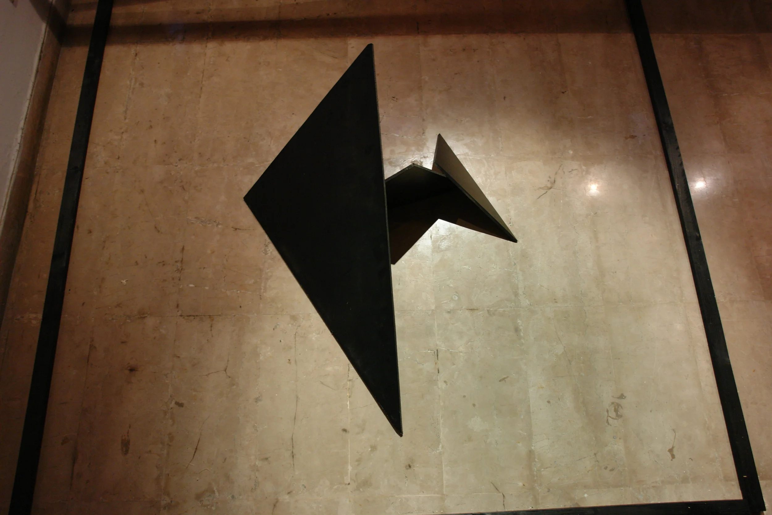  Once the large triangular piece of the wall was pushed out of the box structure, during the actual performance-&nbsp;  it could further be unlatched into three smaller triangle forms.     Once the performance was over-  the structures remained- alon