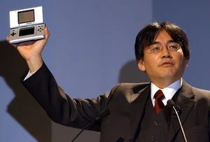 Iwata showing off the original Nintendo DS