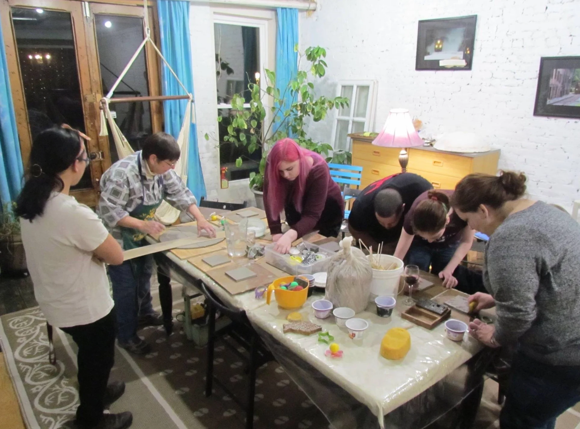 Making clay tiles in the studio during Arts on Main