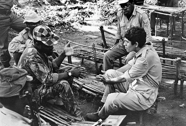 A Portuguese prisoner-of-war talking to his captors in Mozambique. Image Source: Flickr/un_photo