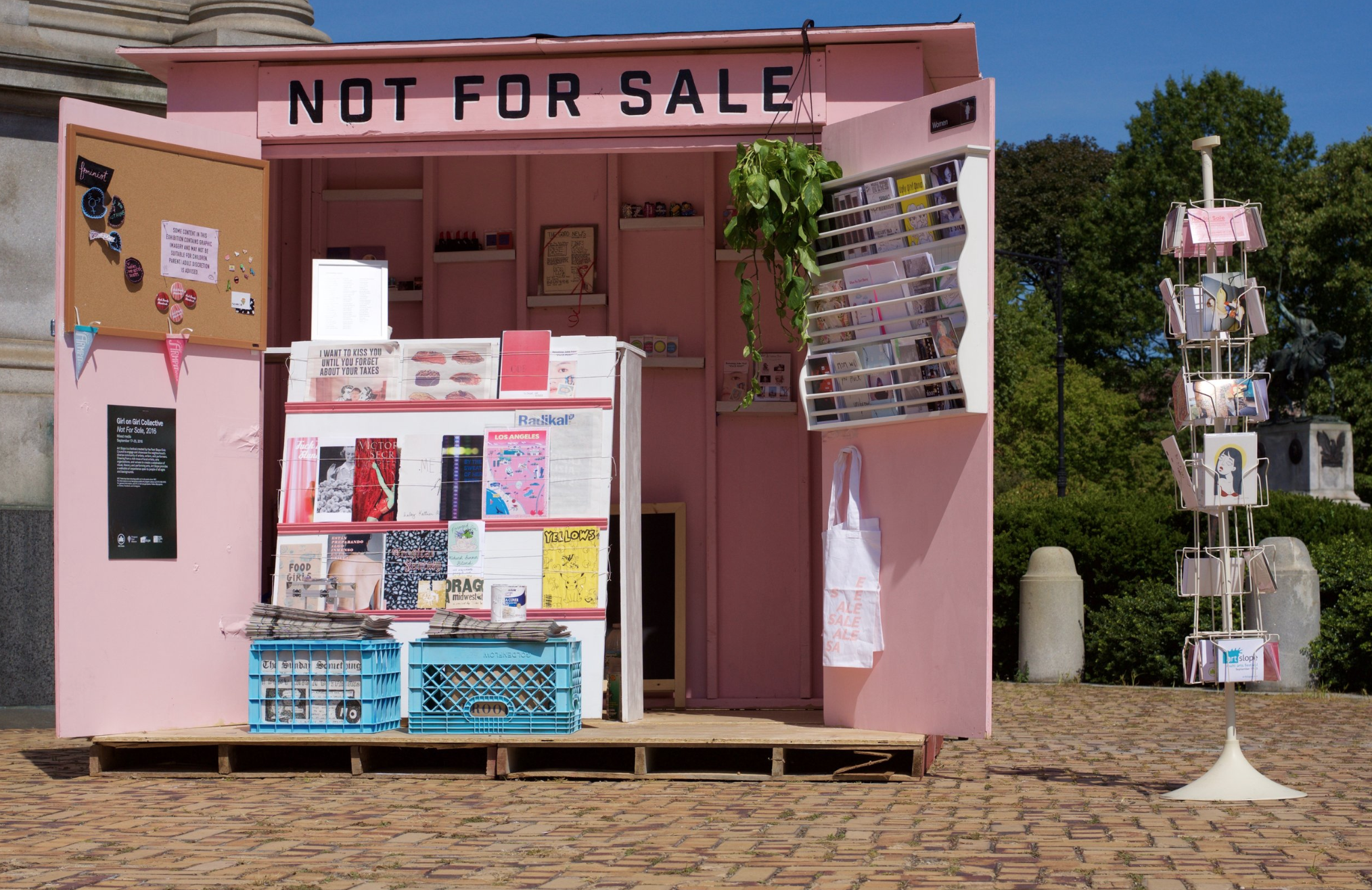 A two-week installation in Prospect Park, BK by Girl on Girl Collective. Not for Sale was a newsstand filled with artwork by 100+ artists from around the world. Art objects took the place of the goods typically found in a newsstand, and conversati