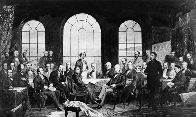 This image, “Fathers of Confederation,” from the Archives of Canada, is an artist’s reconstruction of the Quebec Conference of 1864 which led to the British North America Act of 1867.