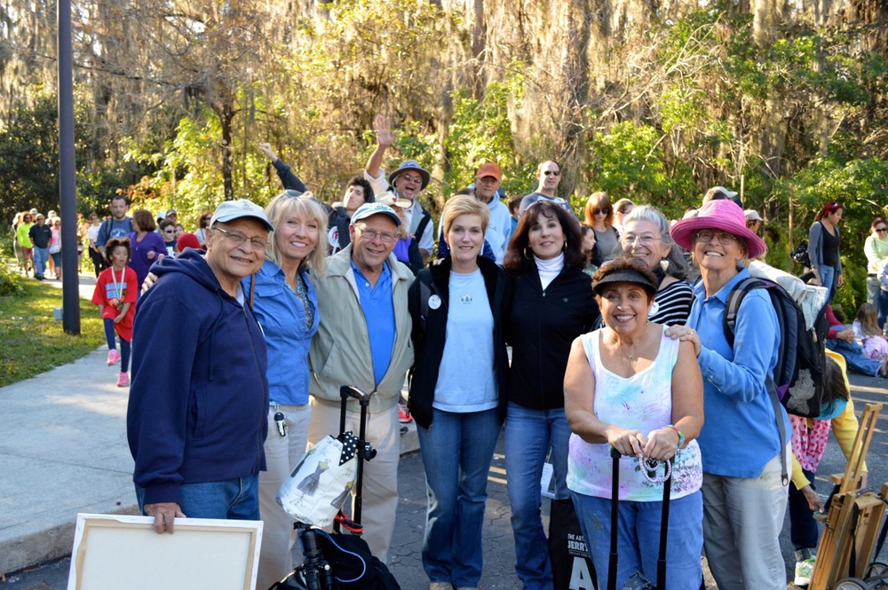 Palm Beach Plein Air group waiting for a bus after a long day at Loxahatchee painting competition.