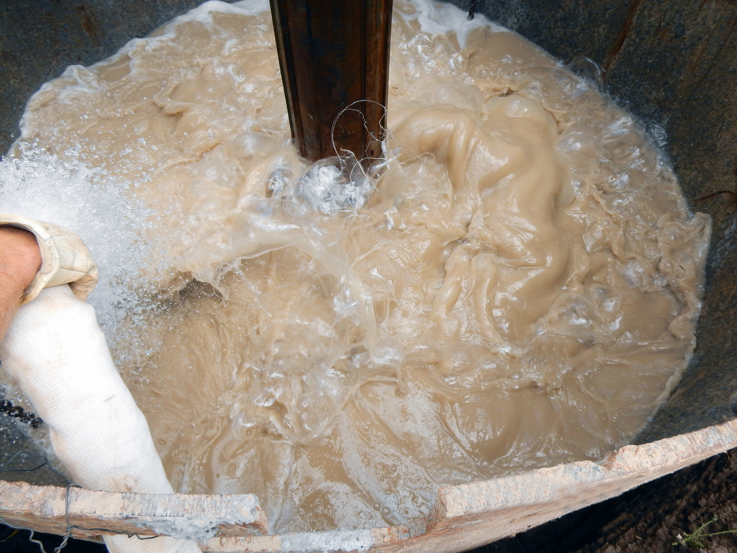 Big Foot slurry being mixed in hole.JPG